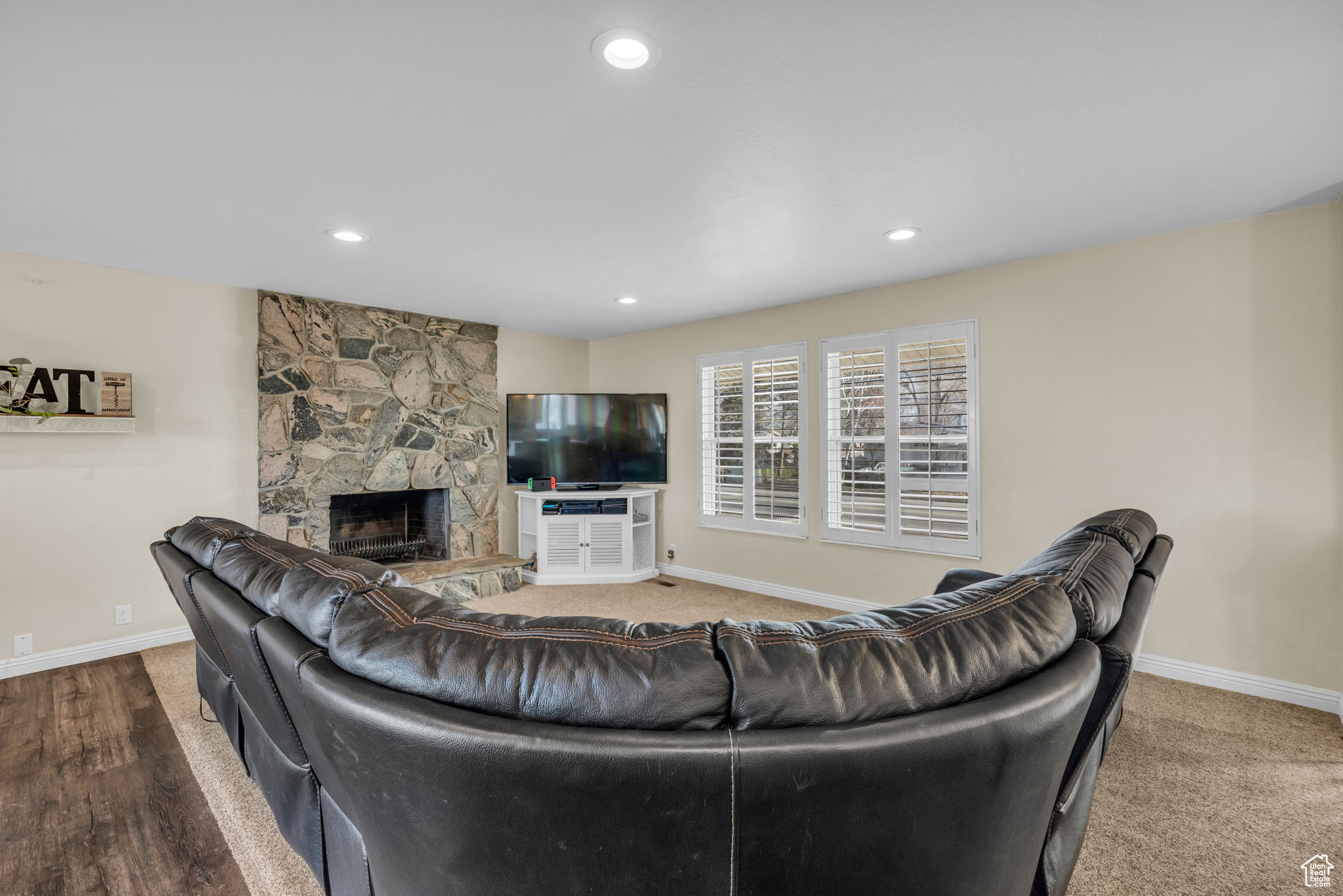 Living room featuring hardwood / wood-style floors and a fireplace