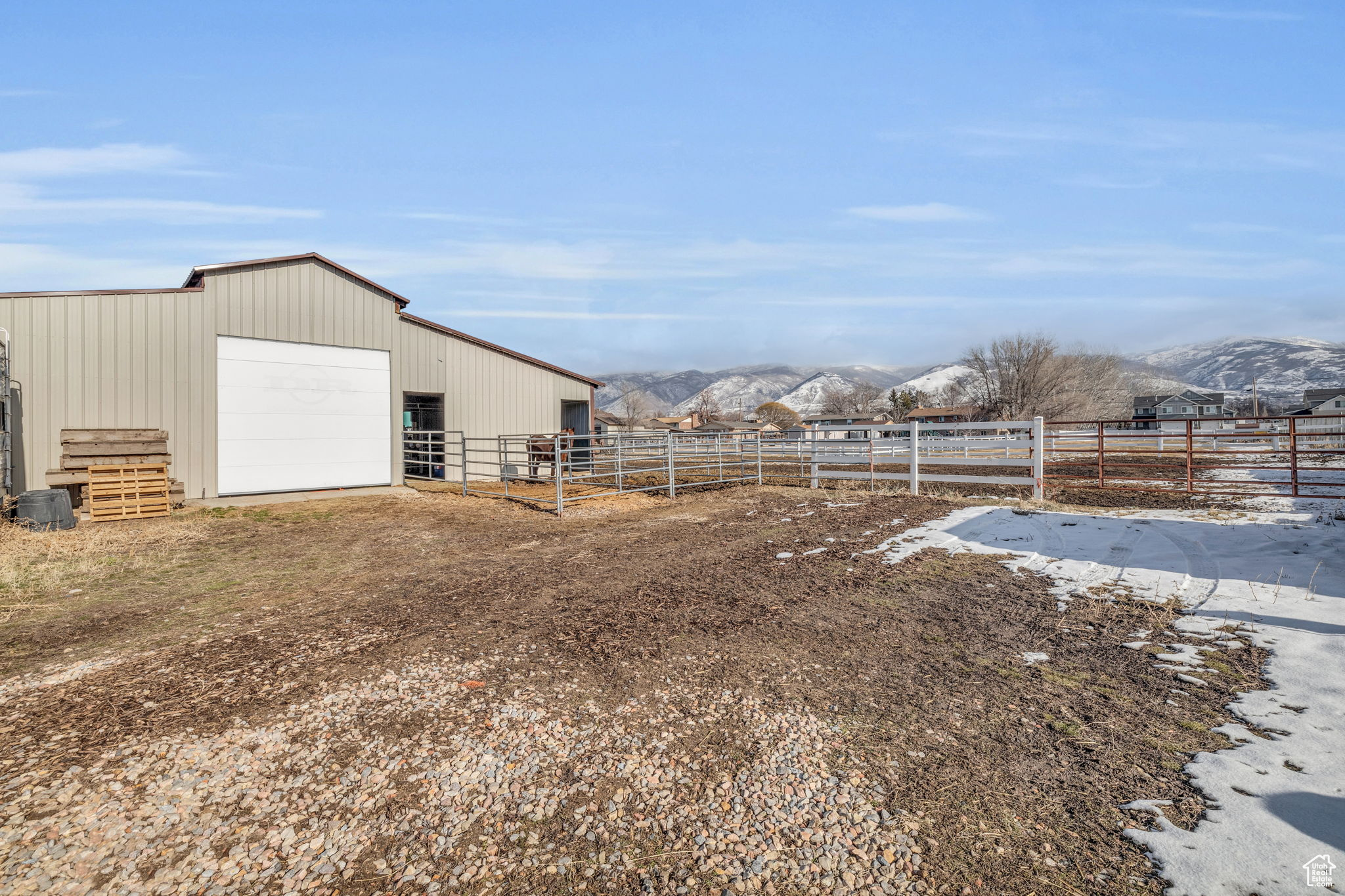 View of yard featuring a rural view, a mountain view, and an outbuilding