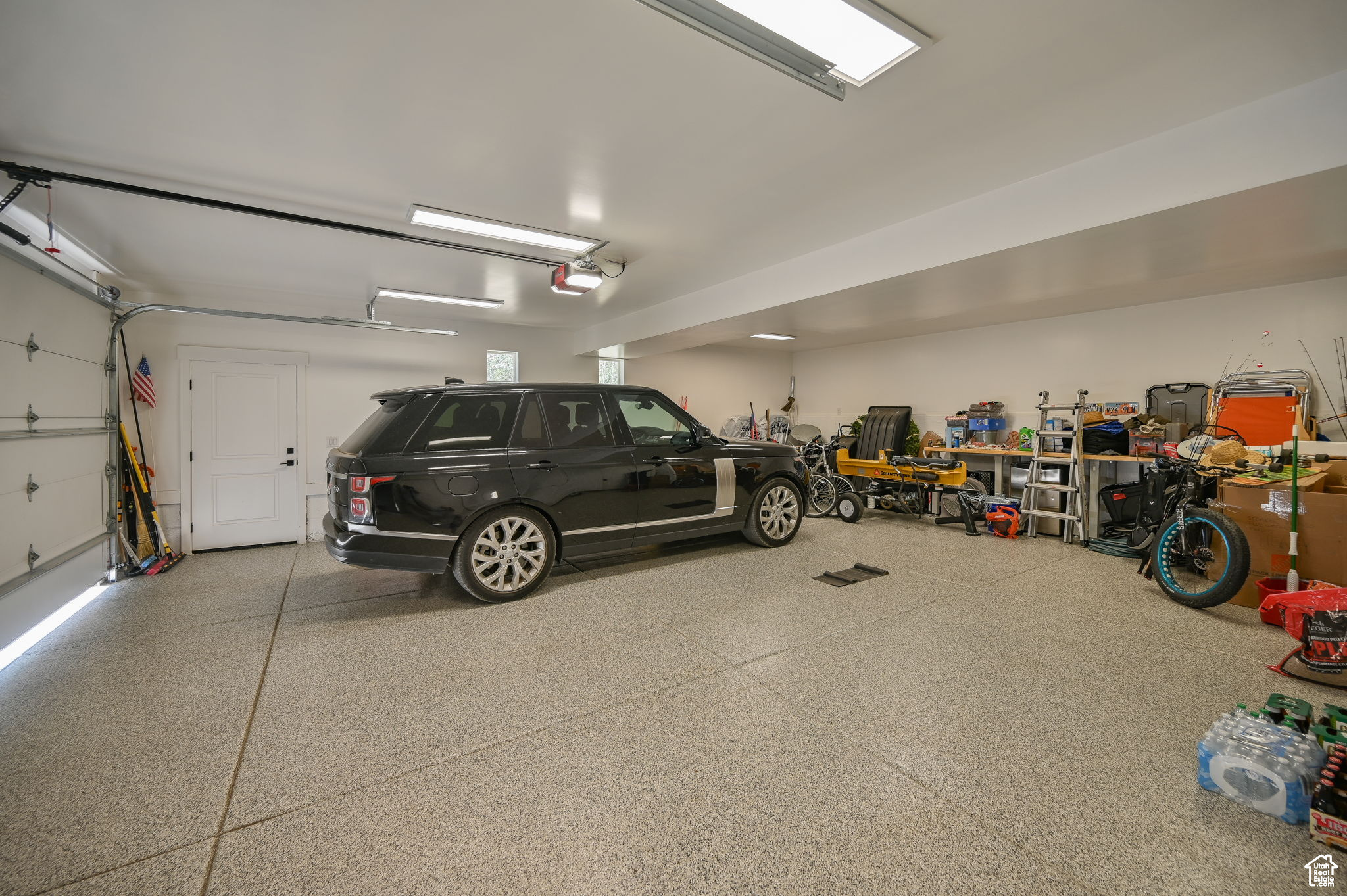 Garage featuring a garage door opener