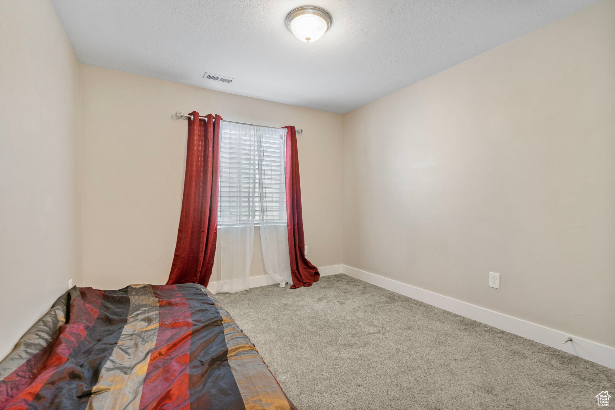 Bedroom featuring carpet flooring