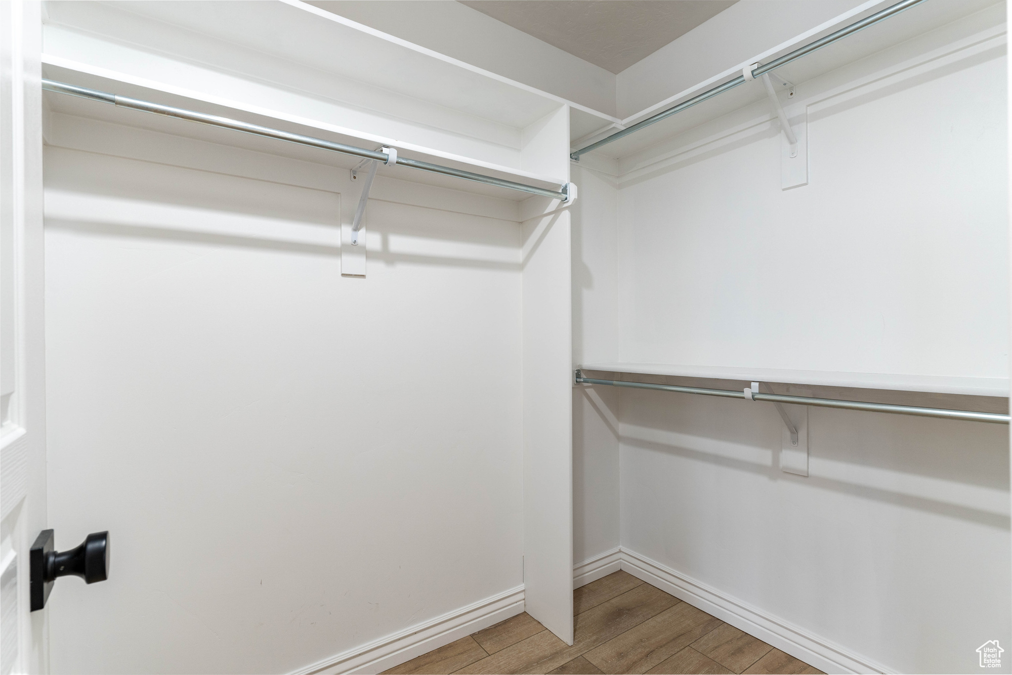 Spacious closet with wood-type flooring