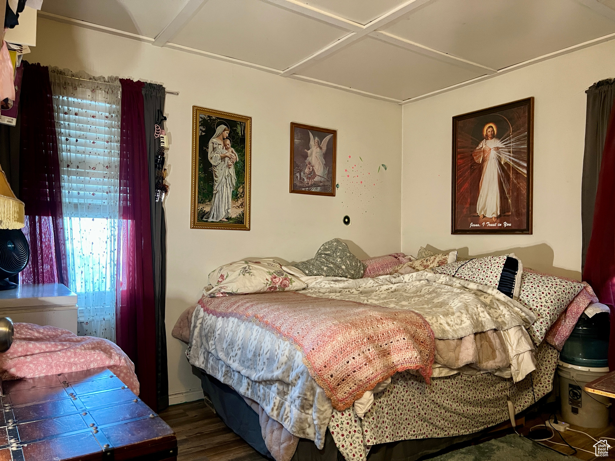 Bedroom featuring dark hardwood / wood-style flooring and coffered ceiling