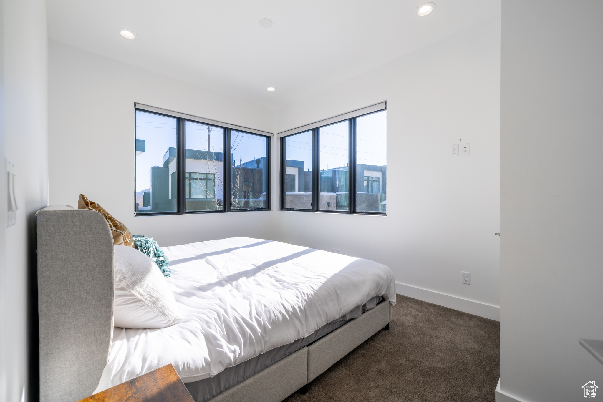 Bedroom with dark carpet