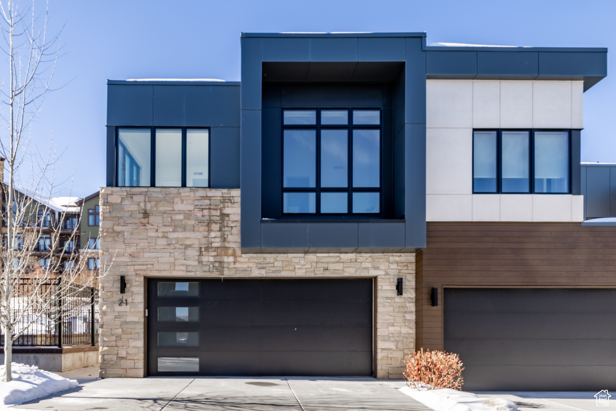 Contemporary home featuring a garage