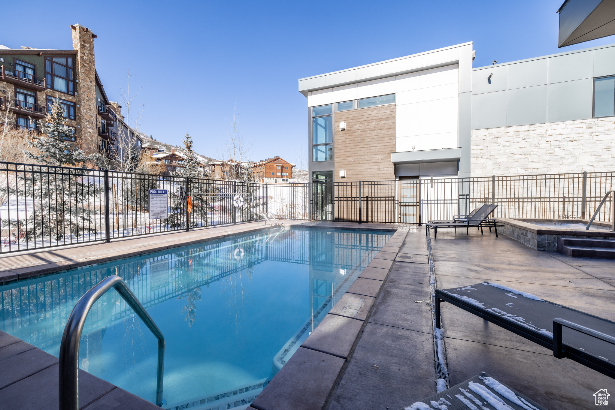 View of swimming pool with a patio area