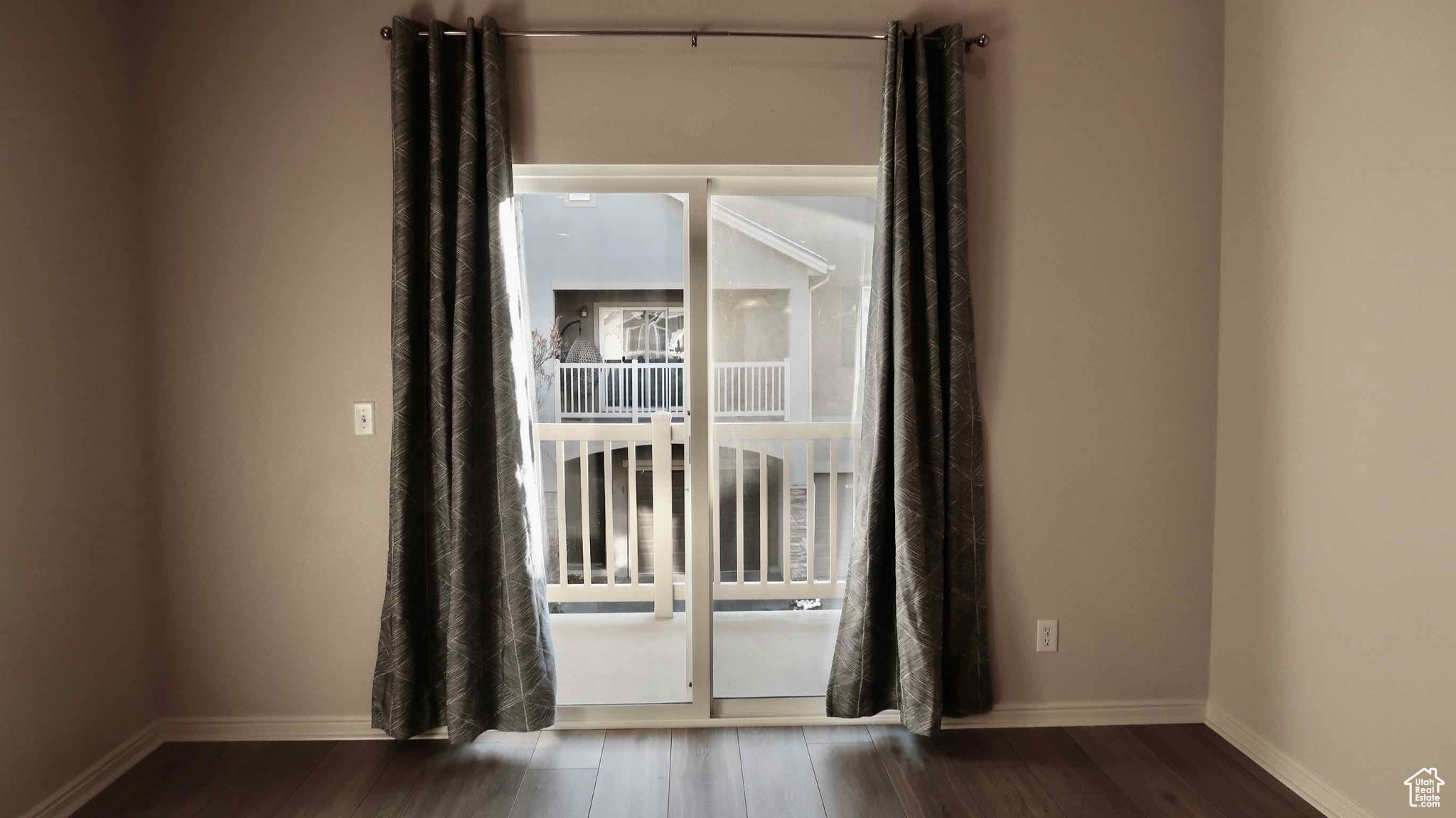 Spare room featuring dark hardwood / wood-style flooring