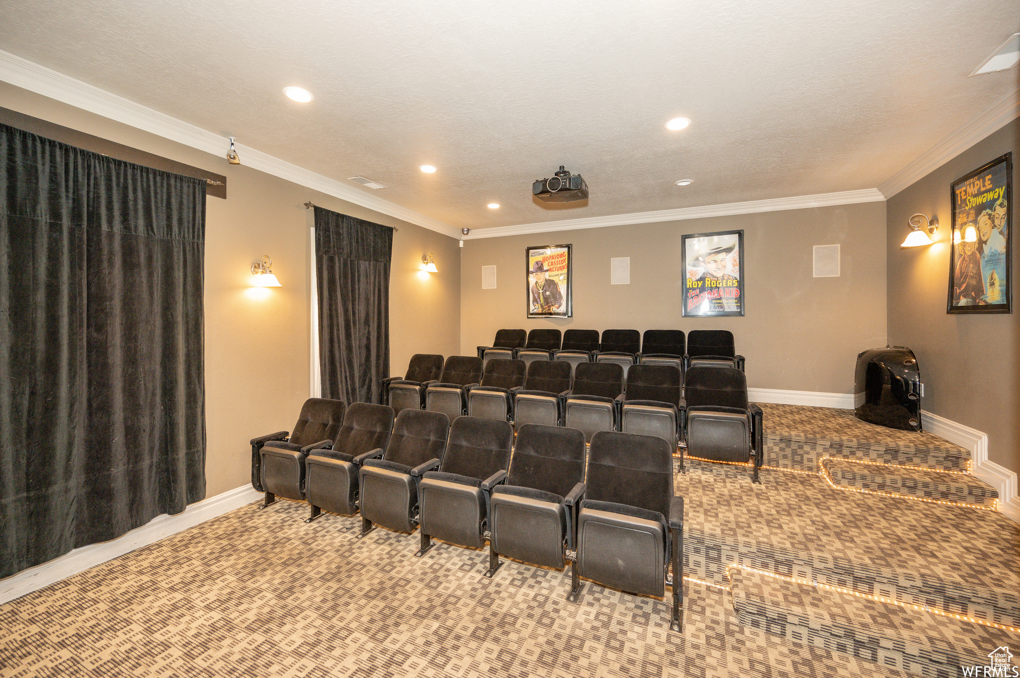 Home theater with light carpet and crown molding