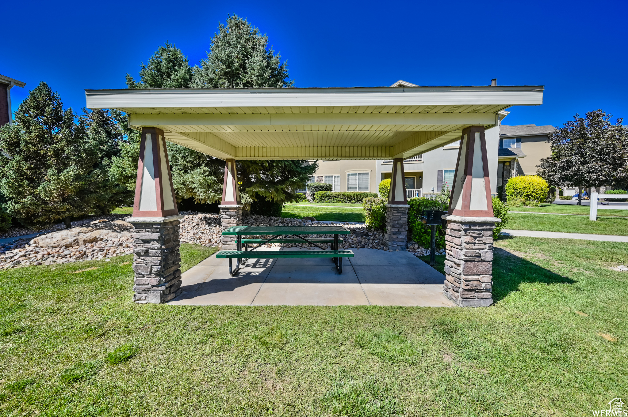 Surrounding community with a lawn, a gazebo, and a patio