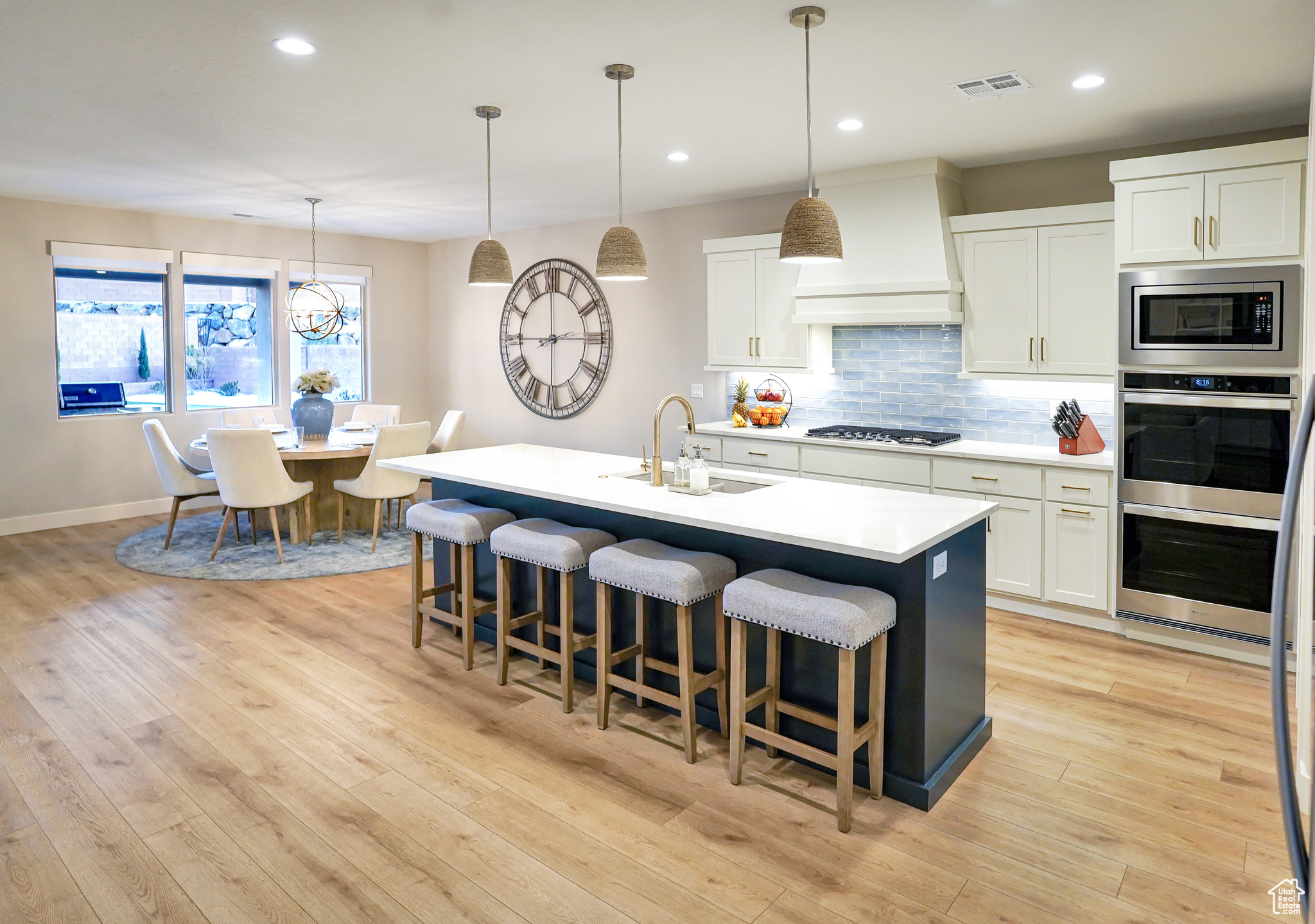 The spacious kitchen, with adjacent dining area, flows seamlessly with the living space to create a feeling of togetherness.