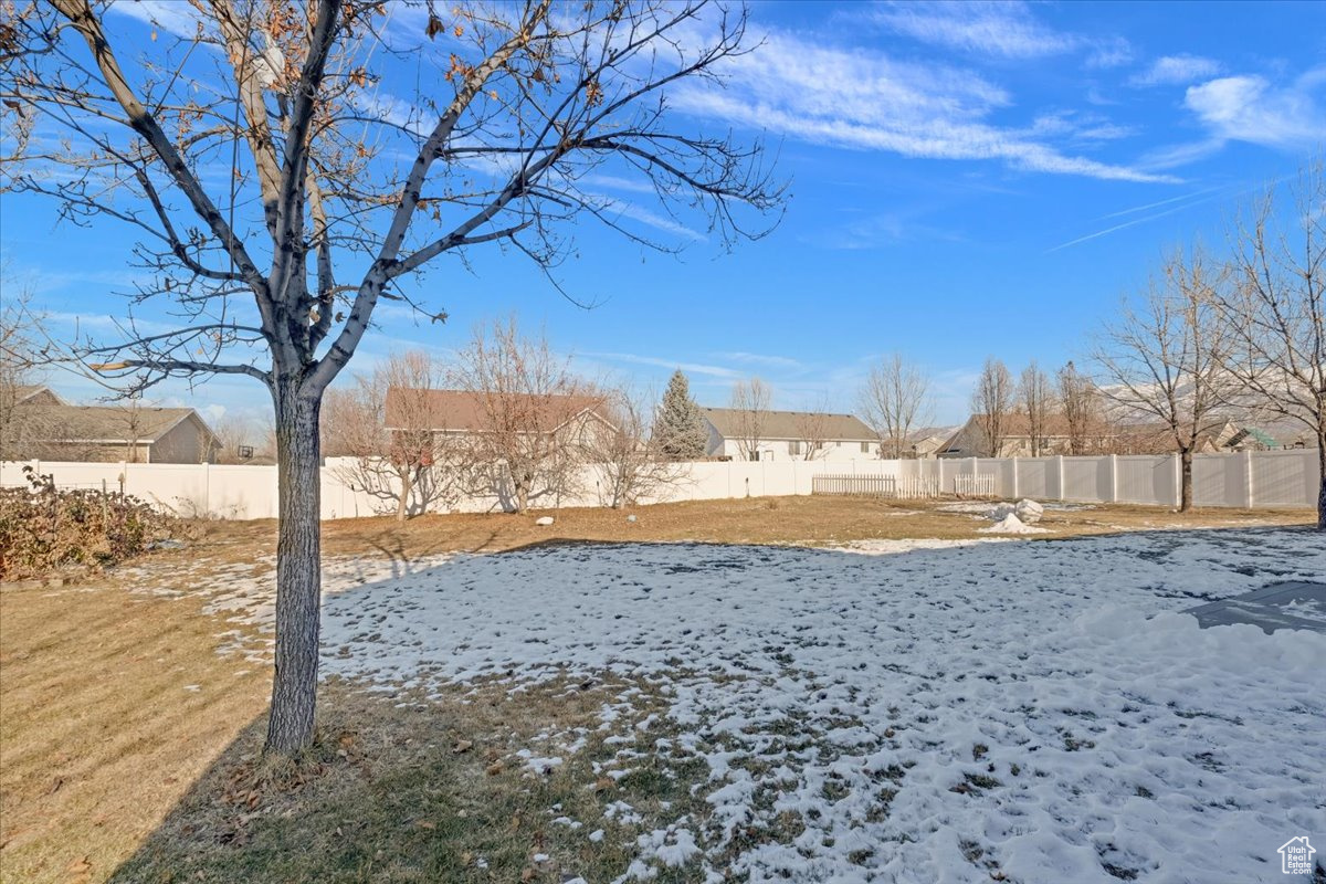 View of yard covered in snow