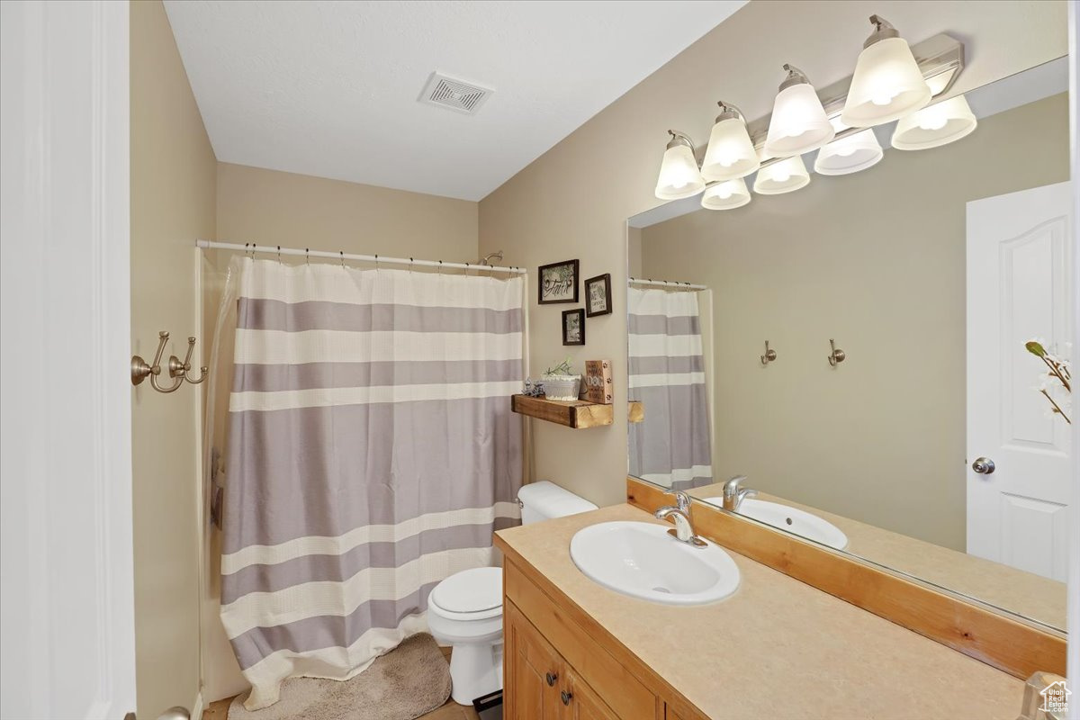 Bathroom with toilet and vanity