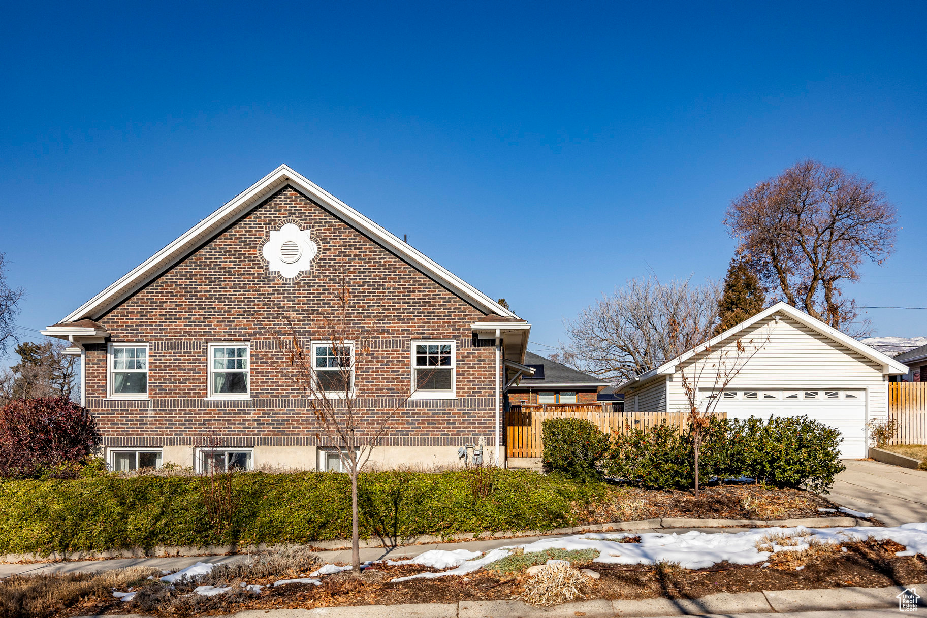 View of side of home featuring a garage