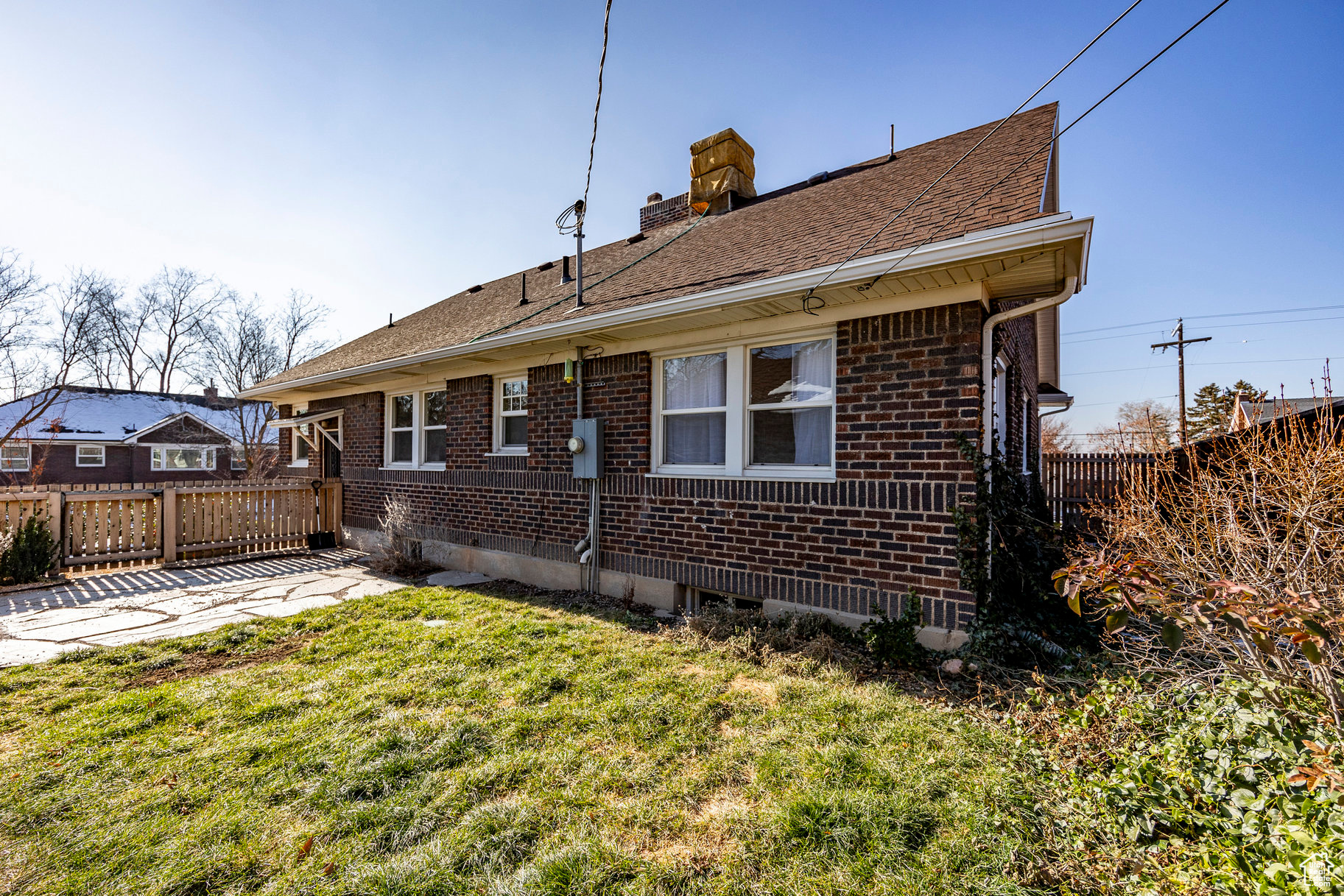 Back of house featuring a yard and a patio