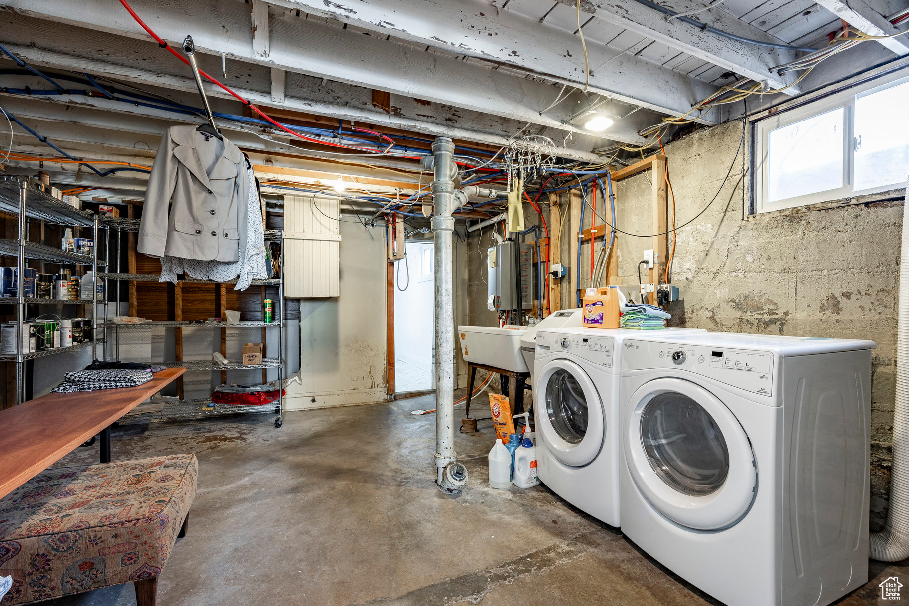 Basement with washer and clothes dryer and sink