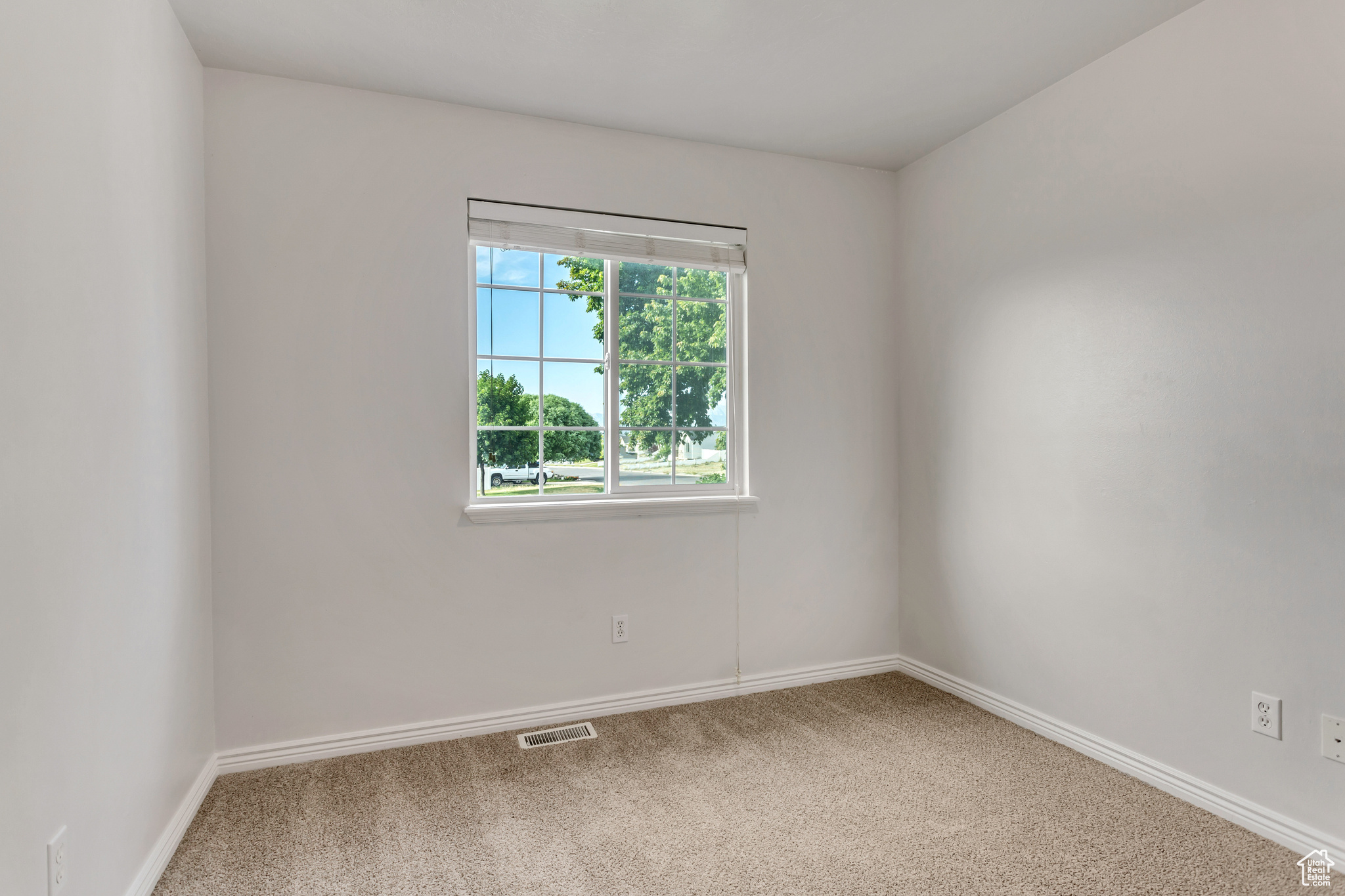 Spare room featuring carpet flooring