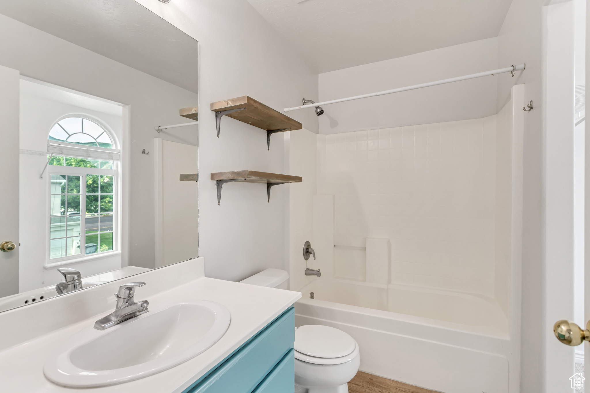 Primary Full bathroom featuring toilet, vanity, and shower / washtub combination