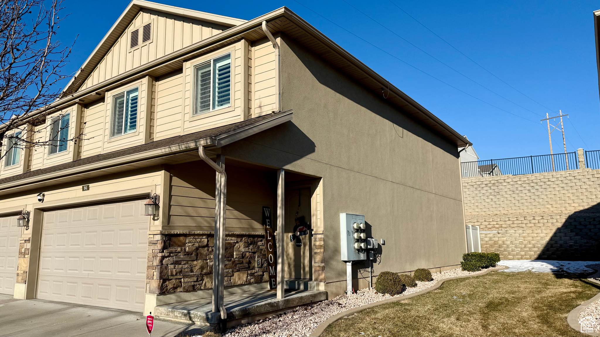 View of side of home featuring a garage