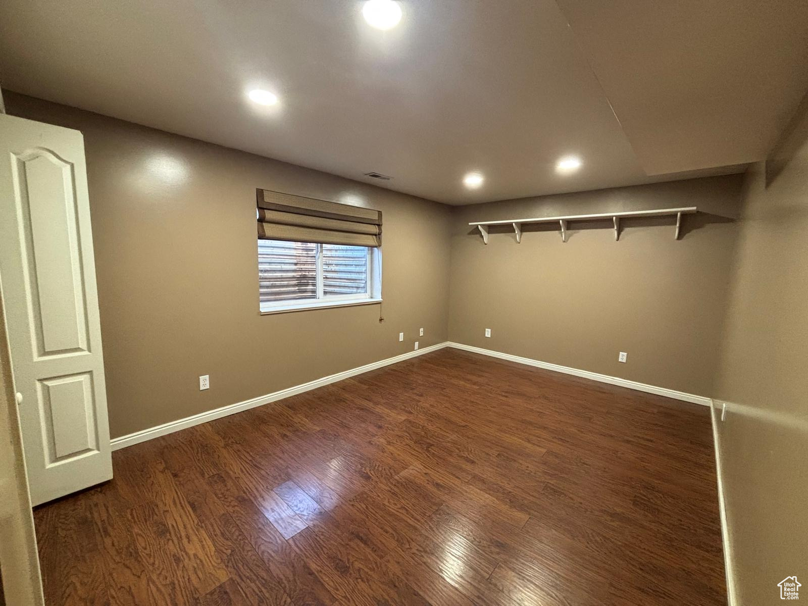 Spare room featuring dark hardwood / wood-style floors