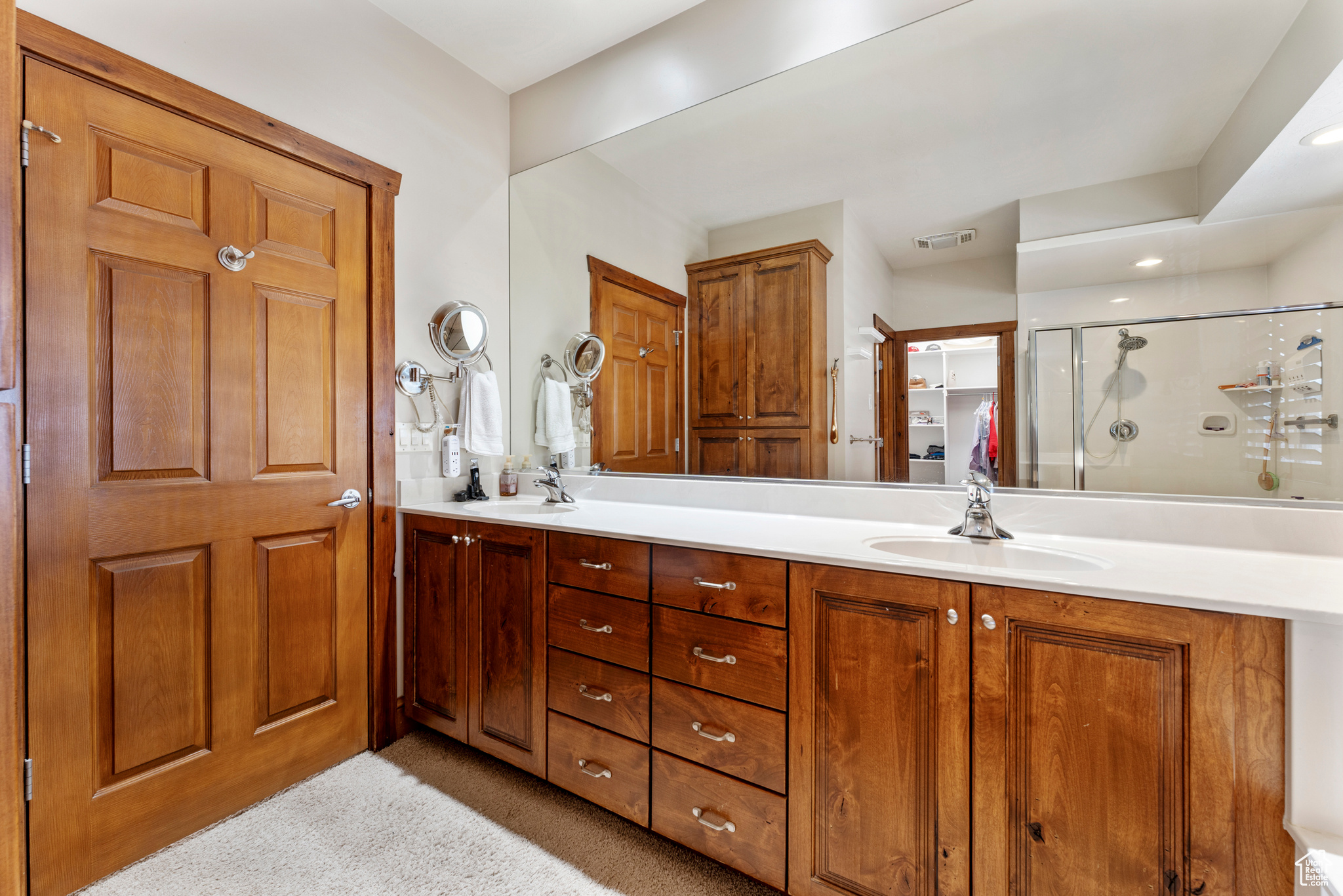 Bathroom featuring vanity and walk in shower