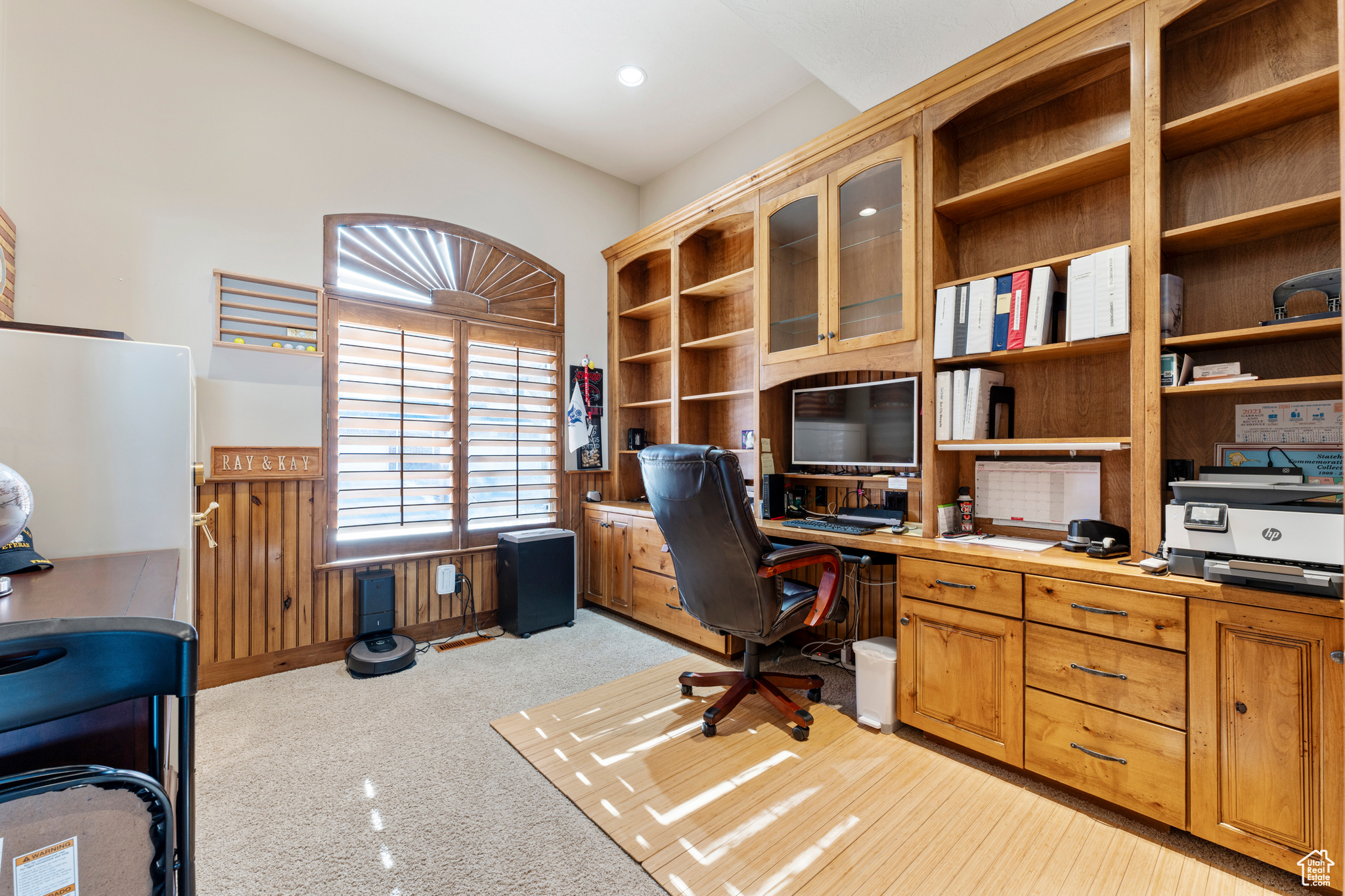 Home office with light carpet