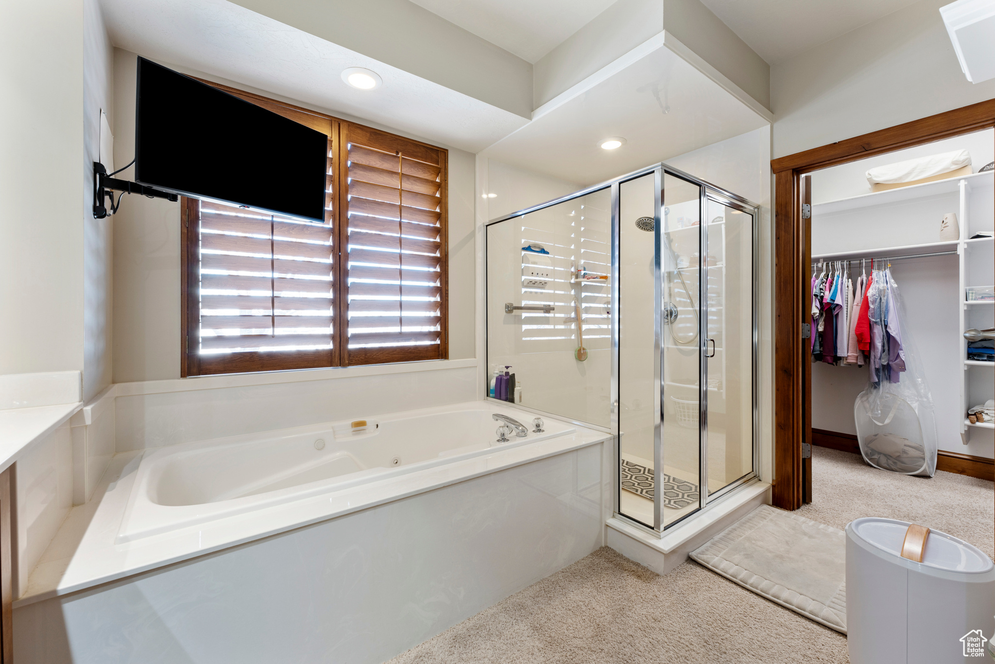 Bathroom featuring separate shower and tub