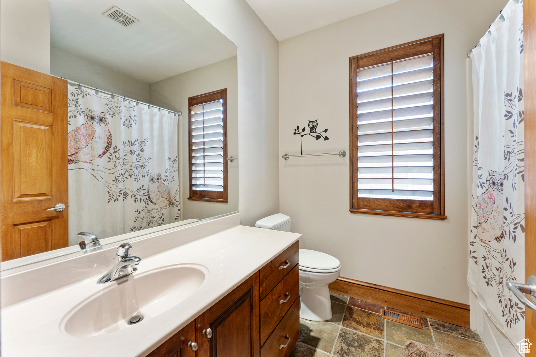 Bathroom with vanity and toilet