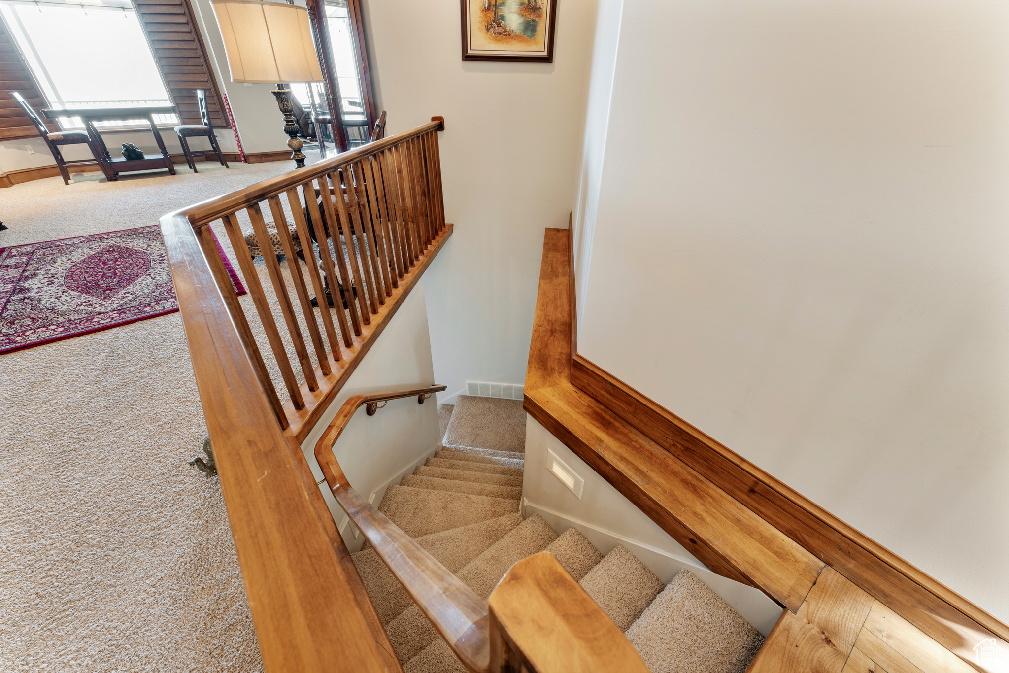 Stairway featuring carpet