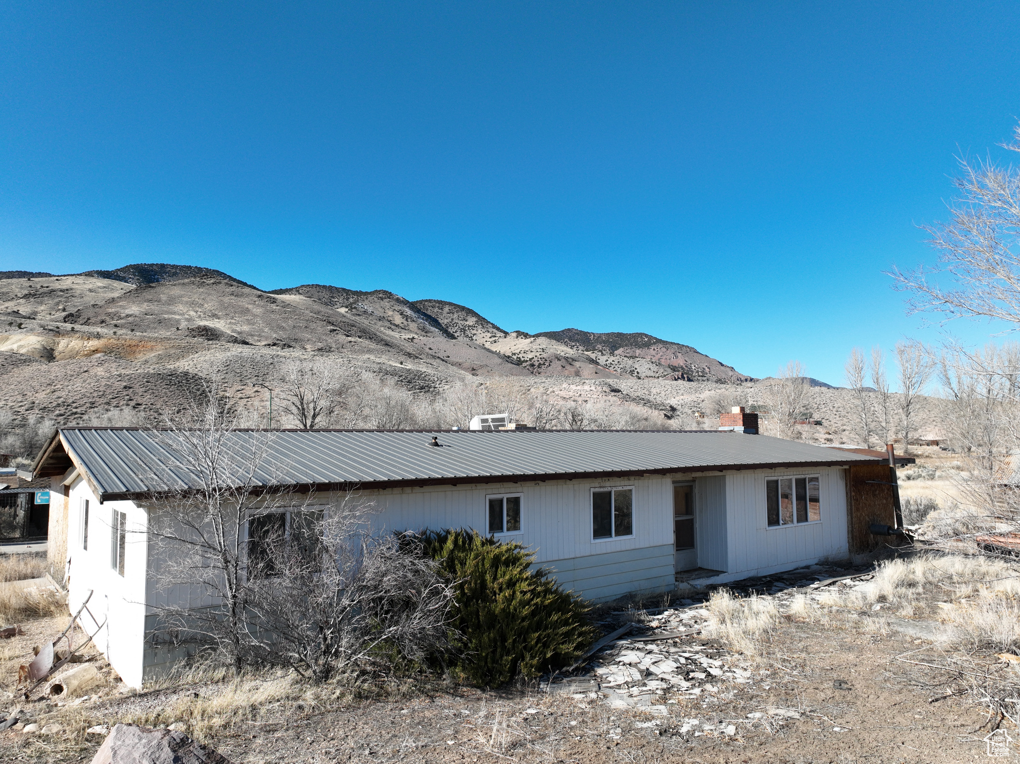 Rear view of property with a mountain view