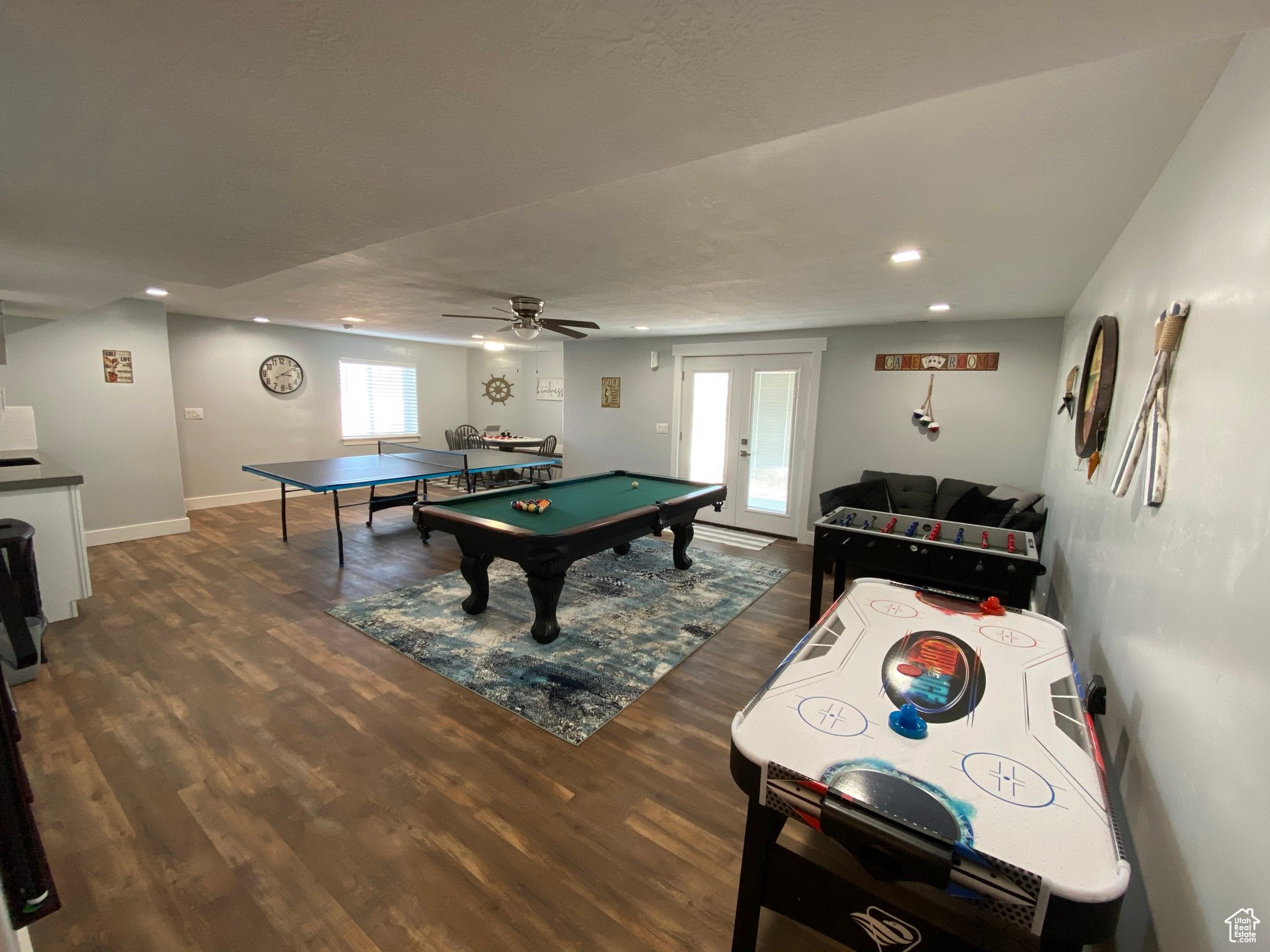 Rec room with ceiling fan, dark wood-type flooring, pool table, and french doors