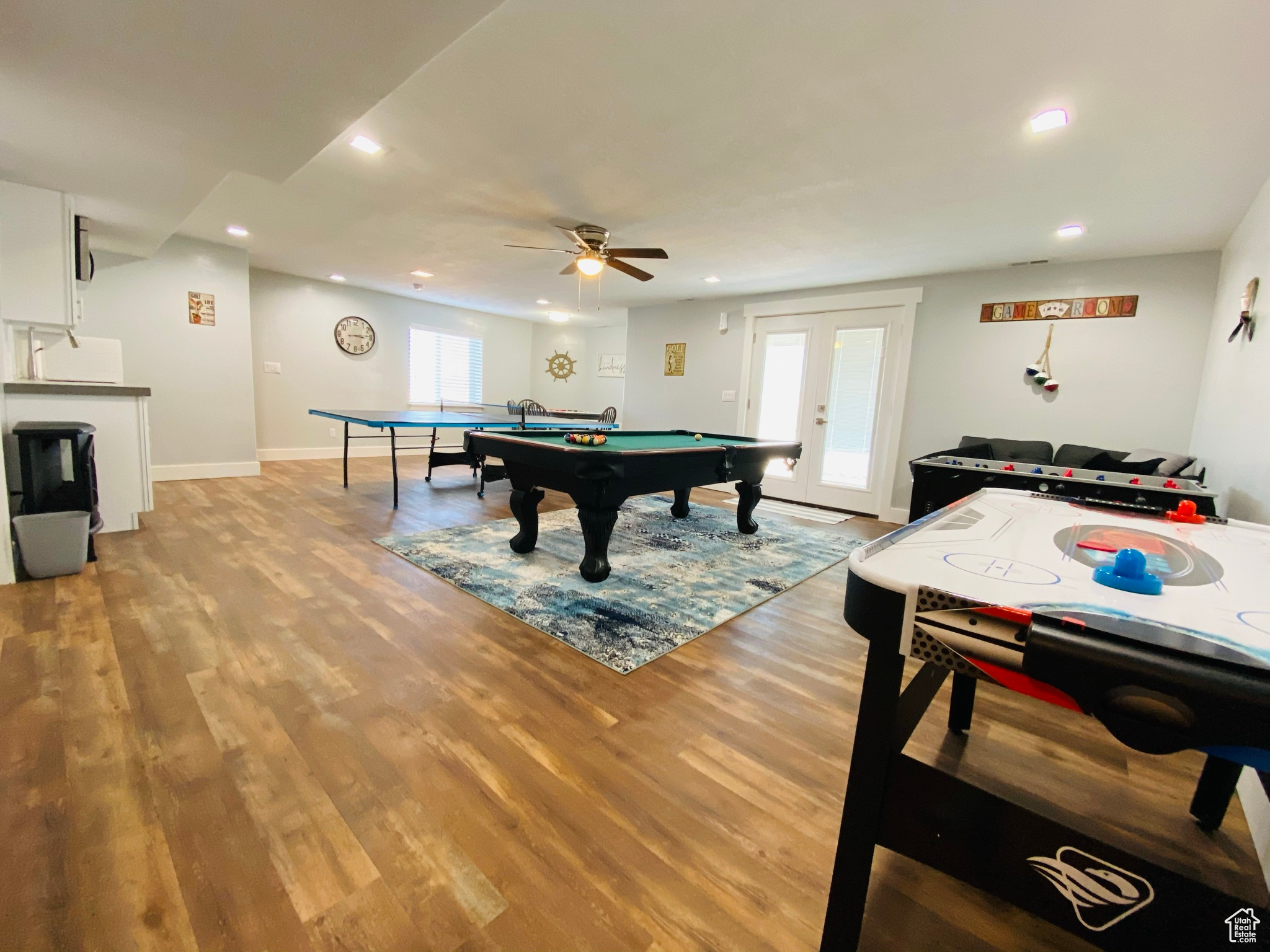 Recreation room with ceiling fan, french doors, pool table, and hardwood / wood-style floors