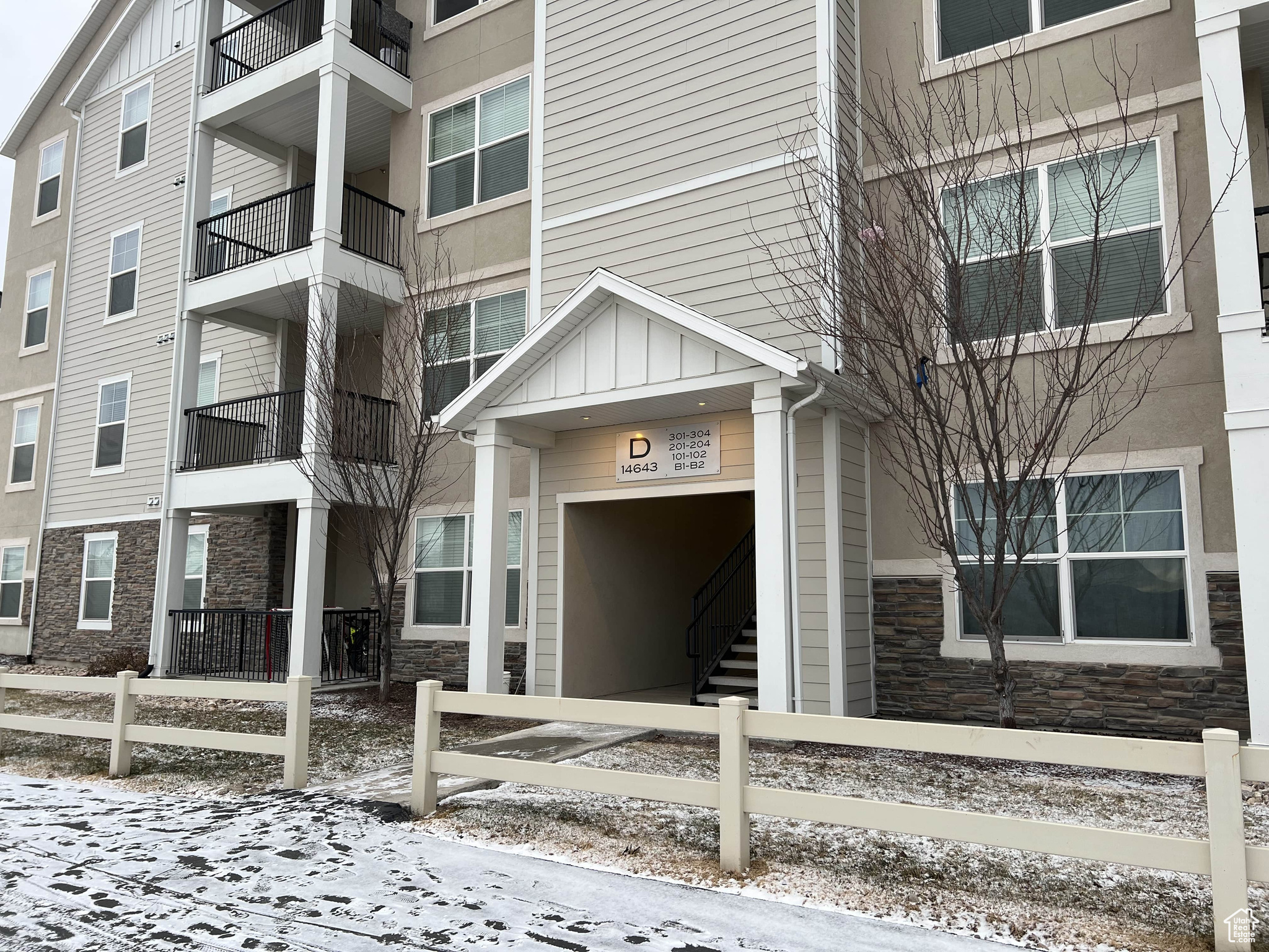 View of snow covered property entrance