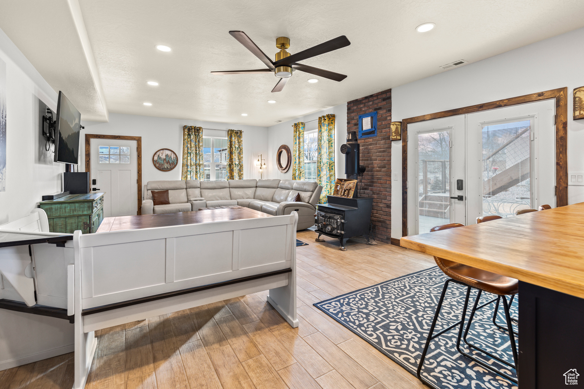 Living room with ceiling fan and french doors