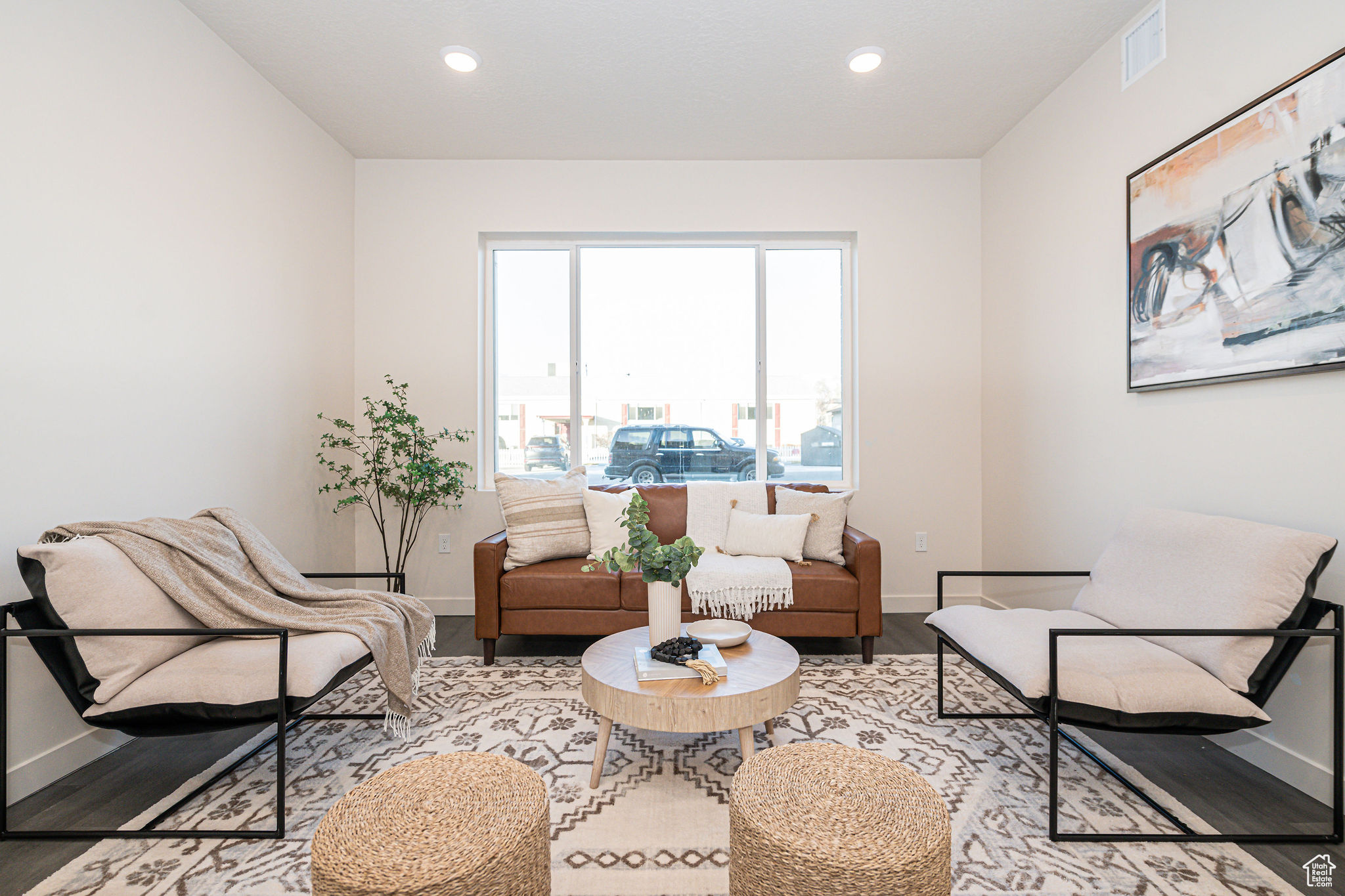 Living area with hardwood / wood-style floors