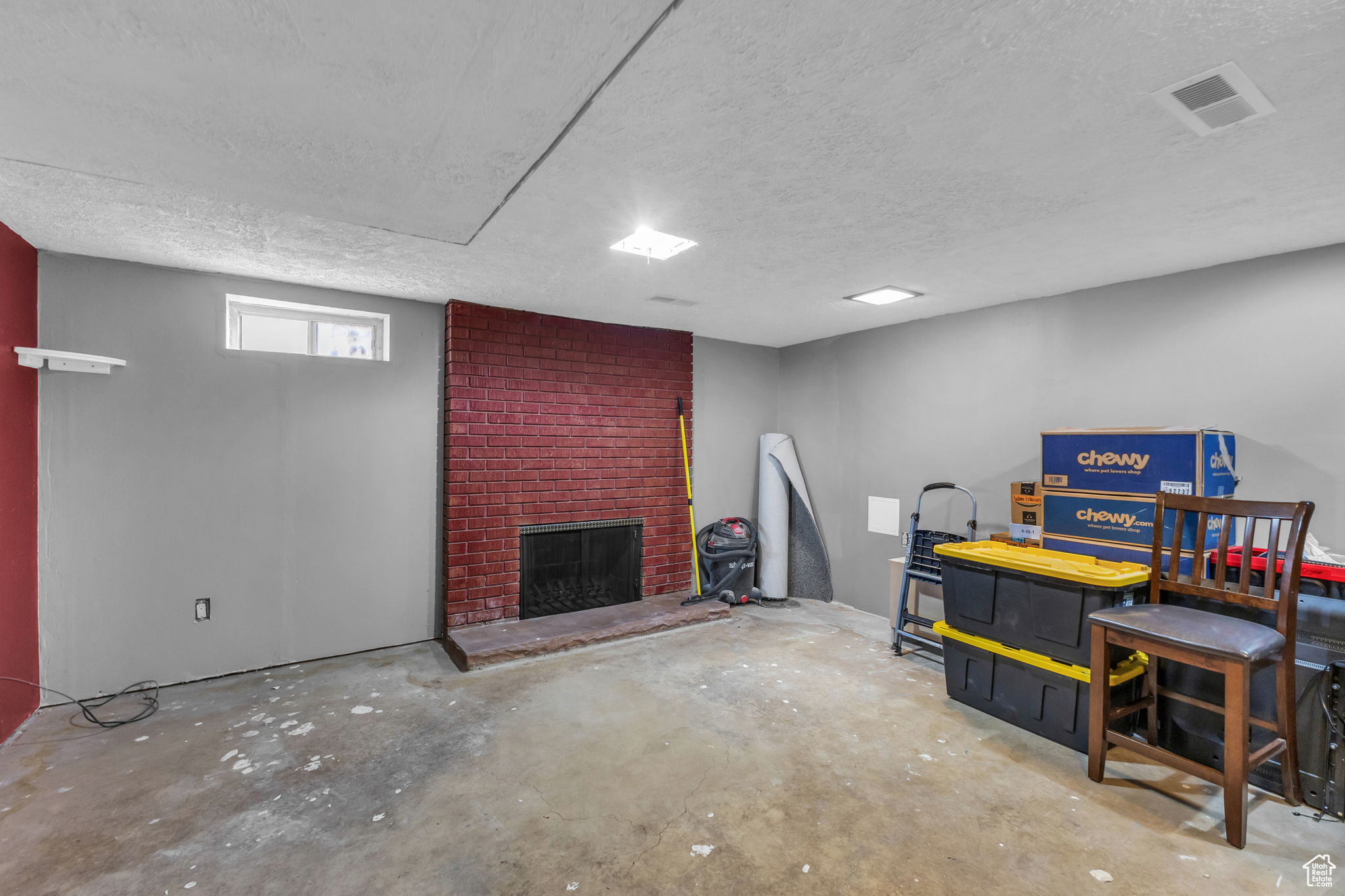 Basement featuring a fireplace and a textured ceiling