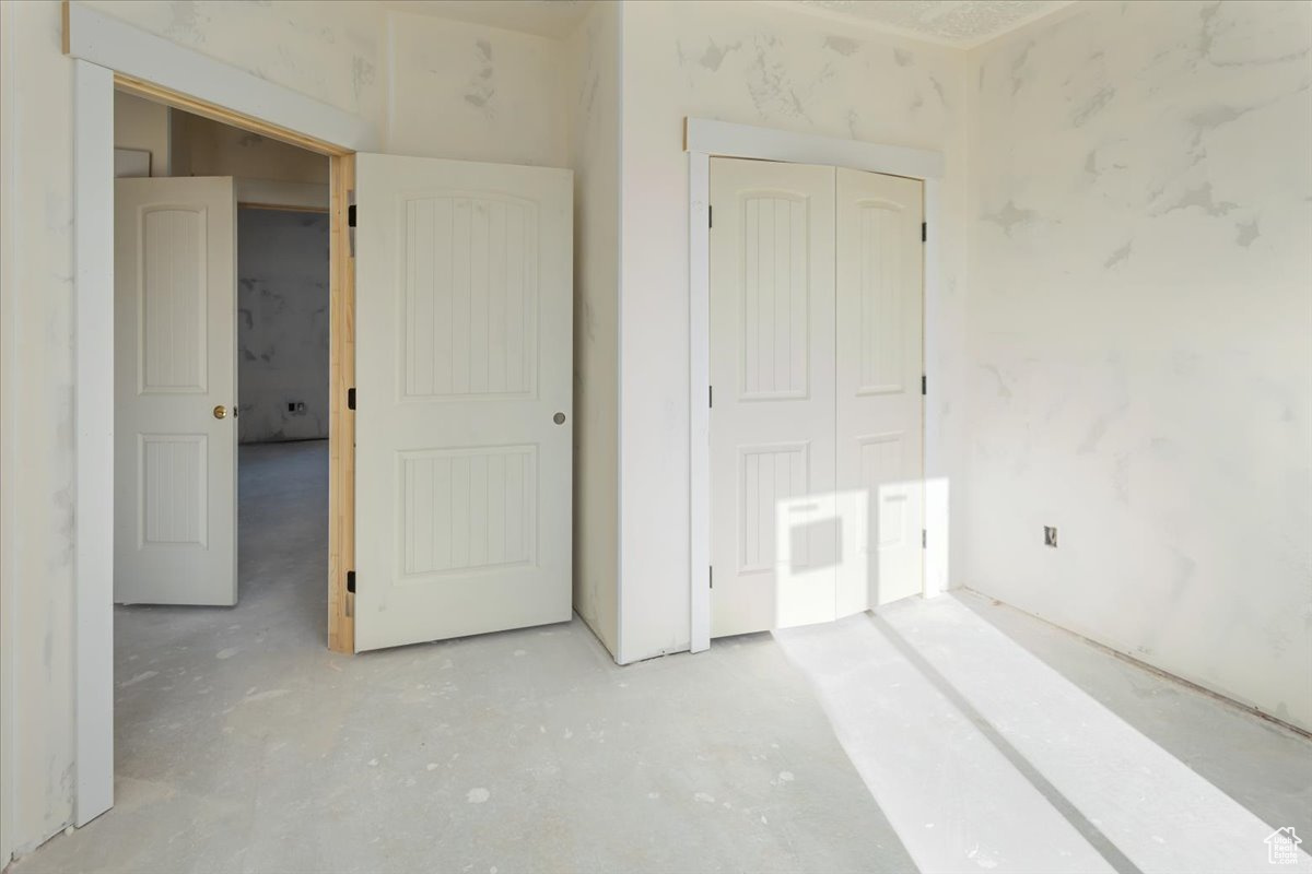 Unfurnished bedroom featuring a closet