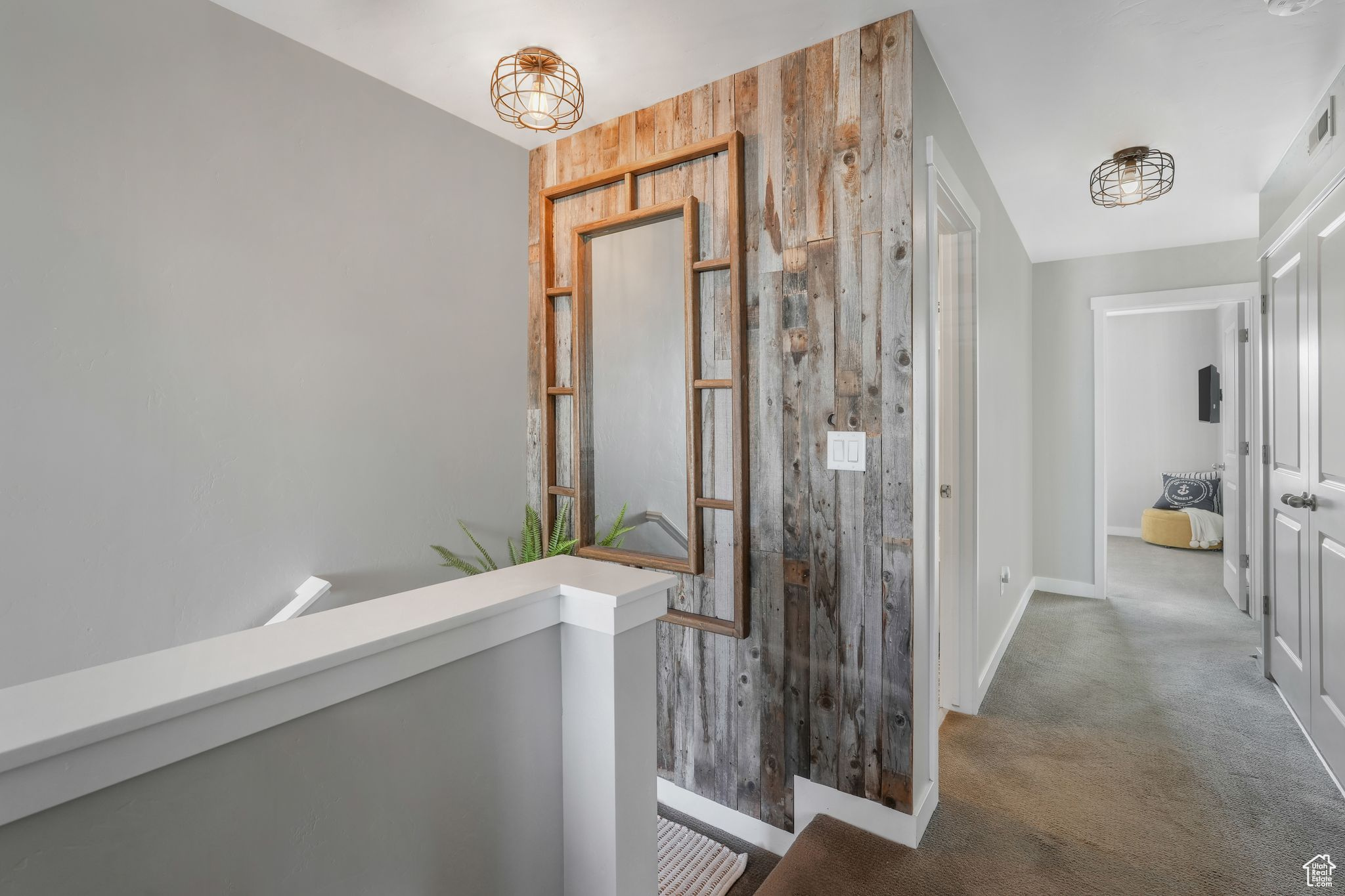 Hallway with wood walls