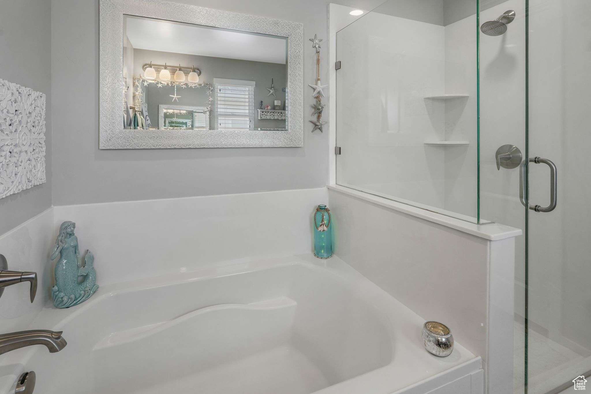 Bathroom featuring separate shower and tub