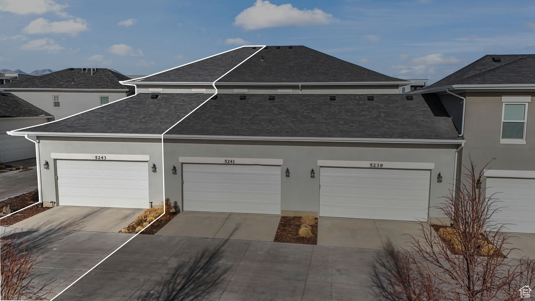 View of front facade featuring a garage