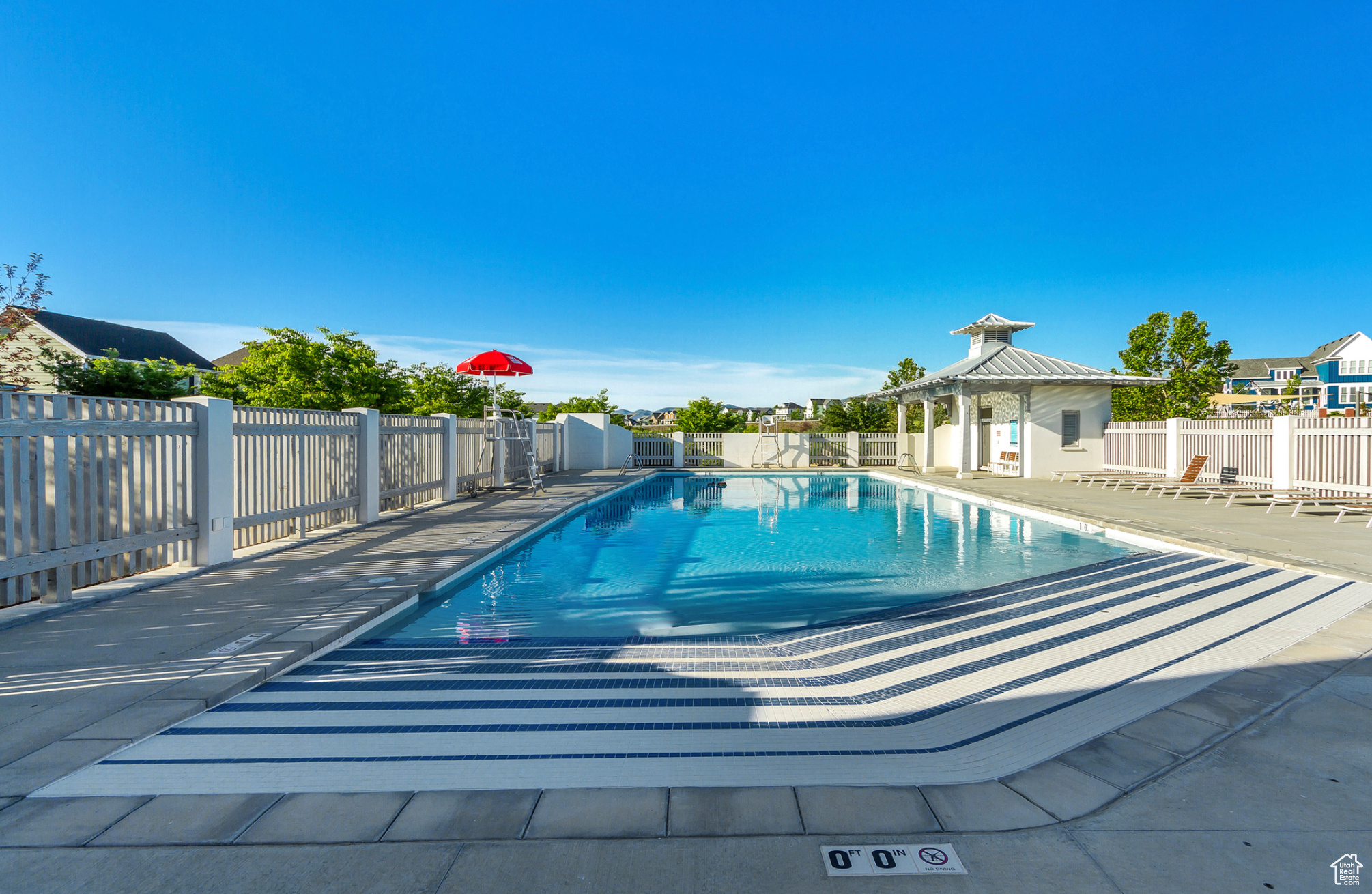 View of pool with a gazebo and a patio