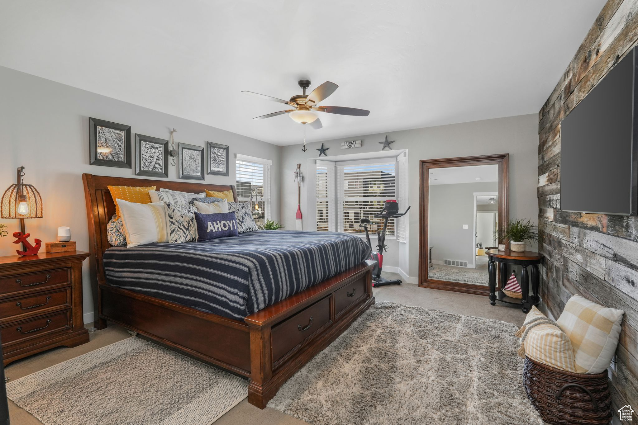 Bedroom with light carpet and ceiling fan