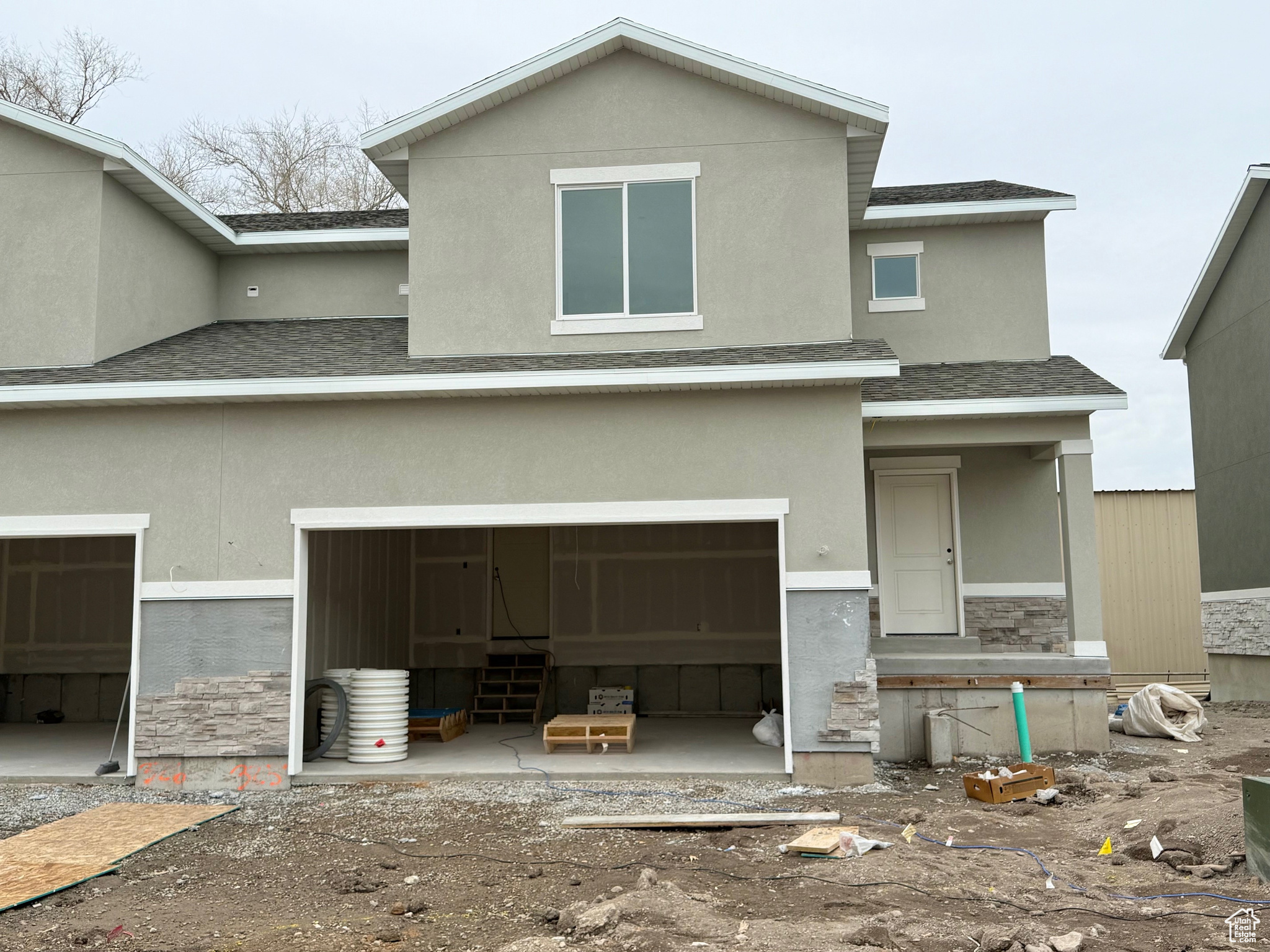 View of front facade featuring a garage