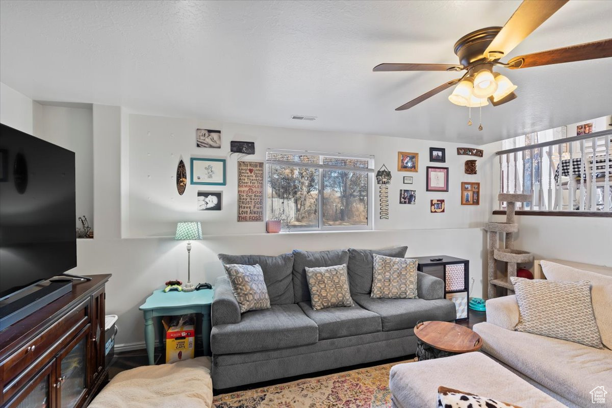 Living room featuring ceiling fan