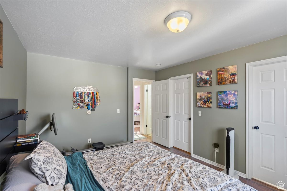 Bedroom with wood-type flooring