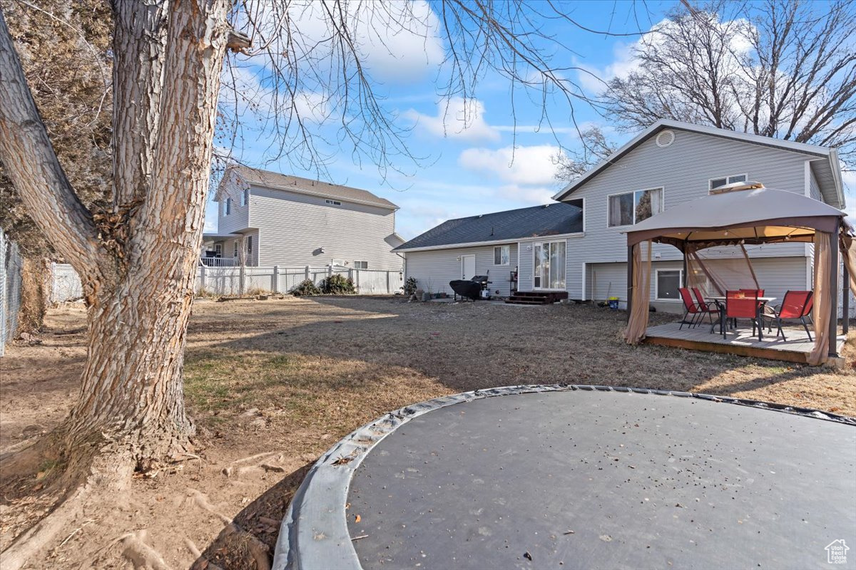 Rear view of property featuring a gazebo