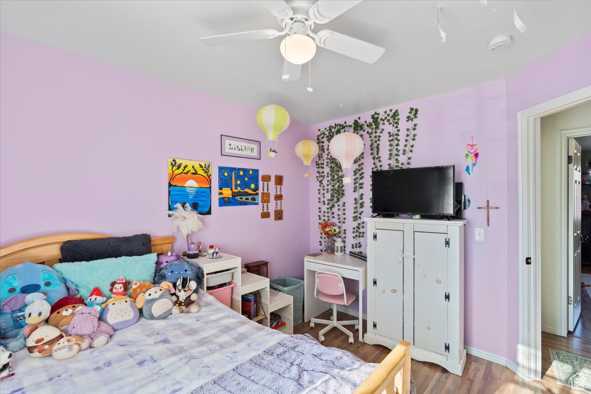 Bedroom featuring ceiling fan and light hardwood / wood-style floors