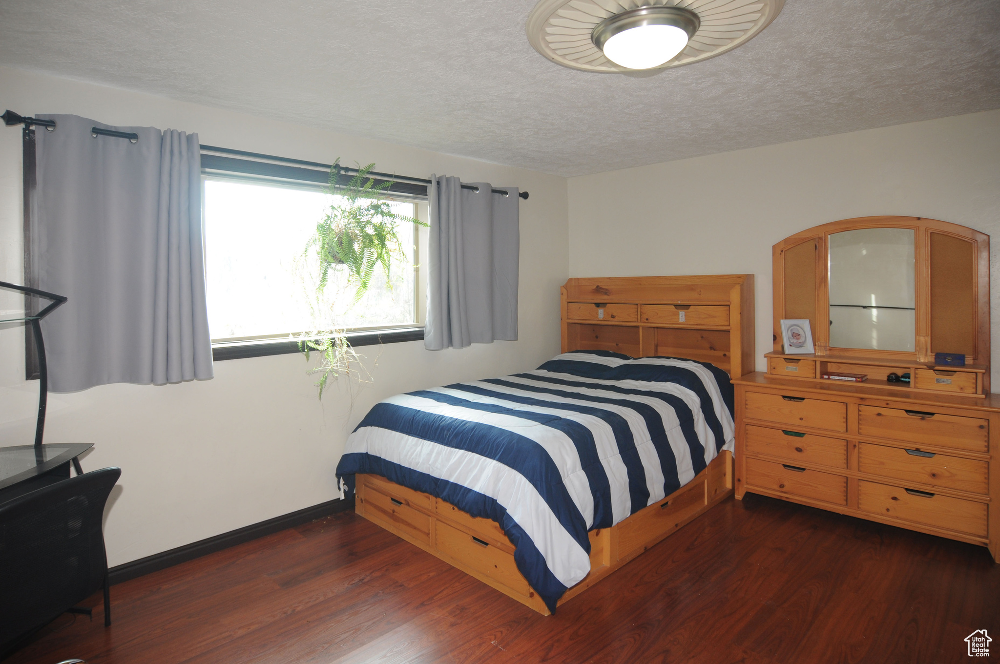 Bedroom featuring dark wood-type flooring