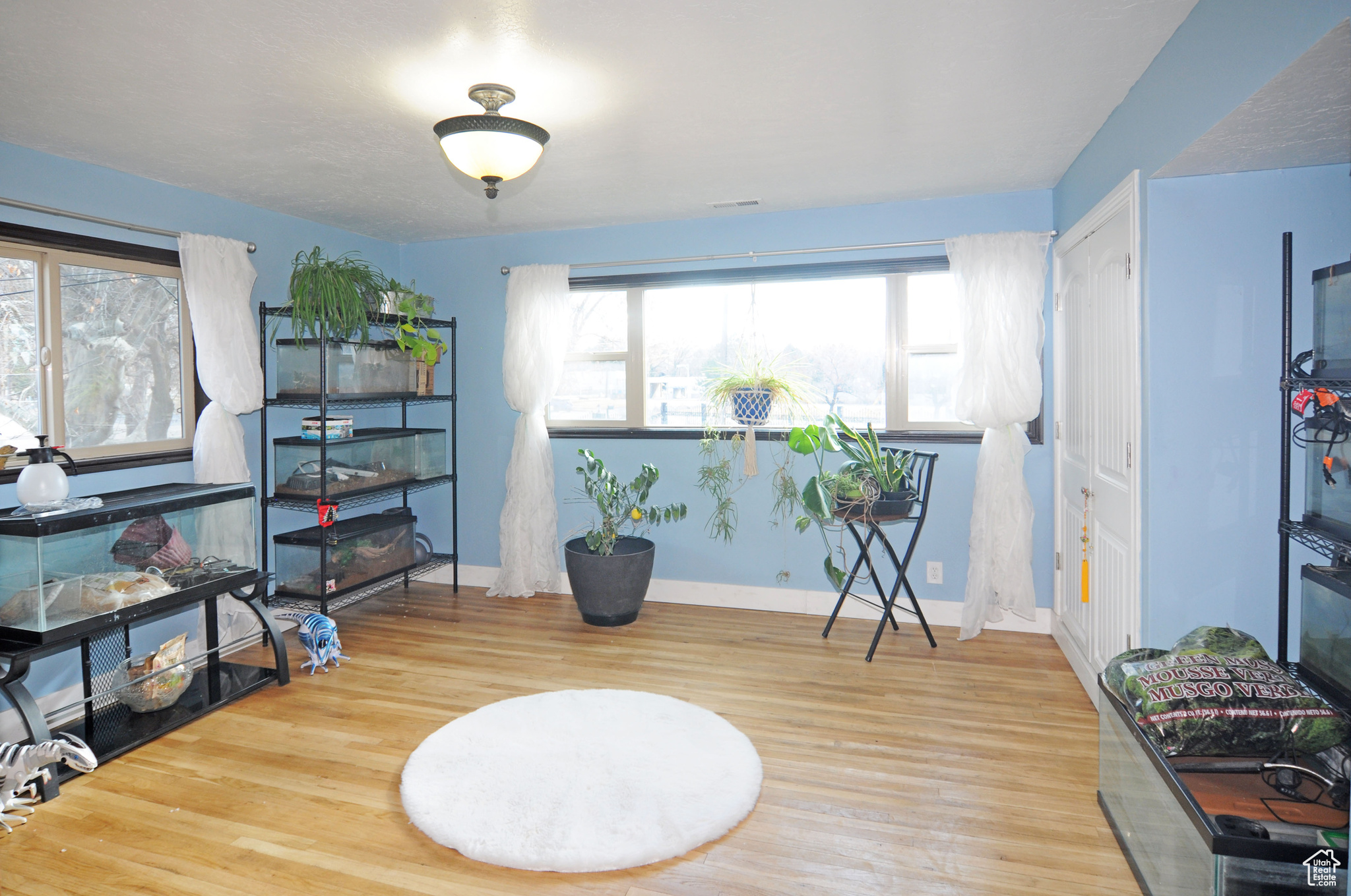 Interior space with hardwood flooring.