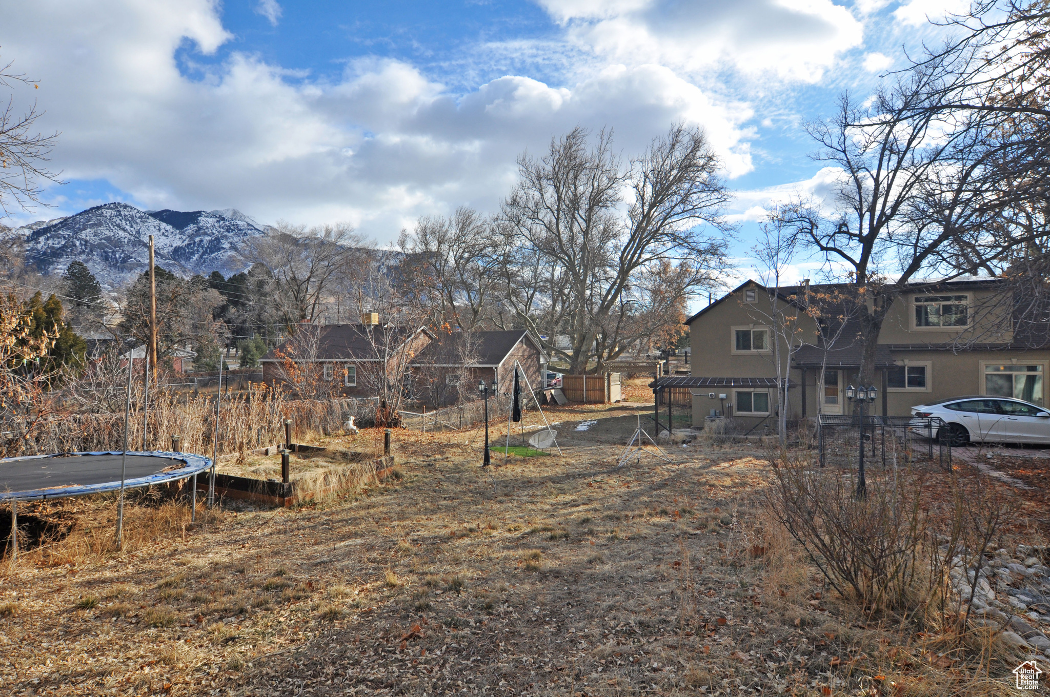 View of yard with a mountain view and a trampoline