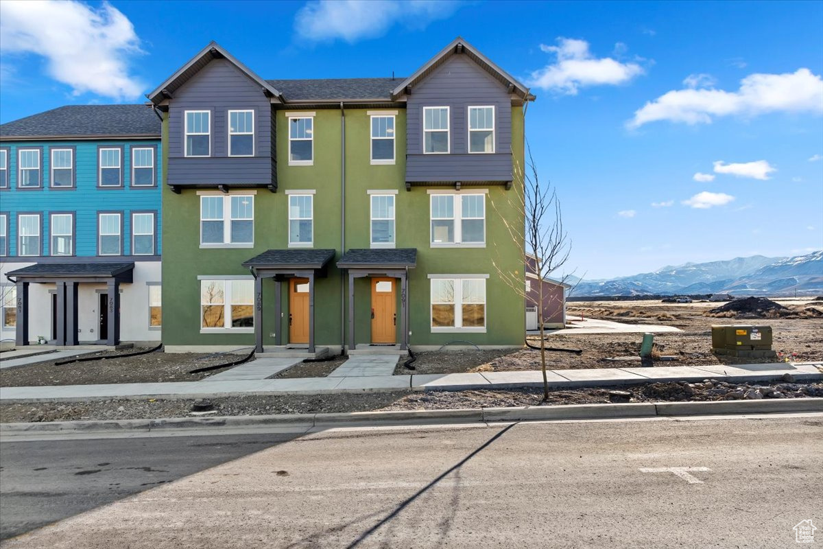 View of property with a mountain view