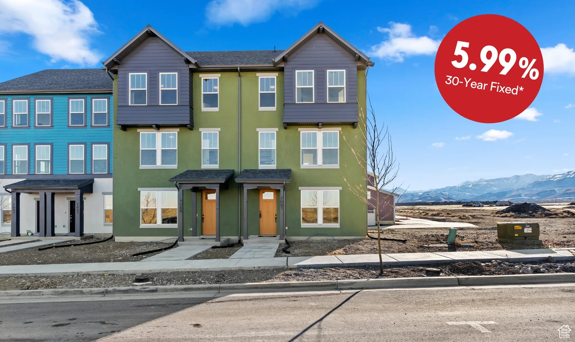 Townhome / multi-family property featuring a mountain view